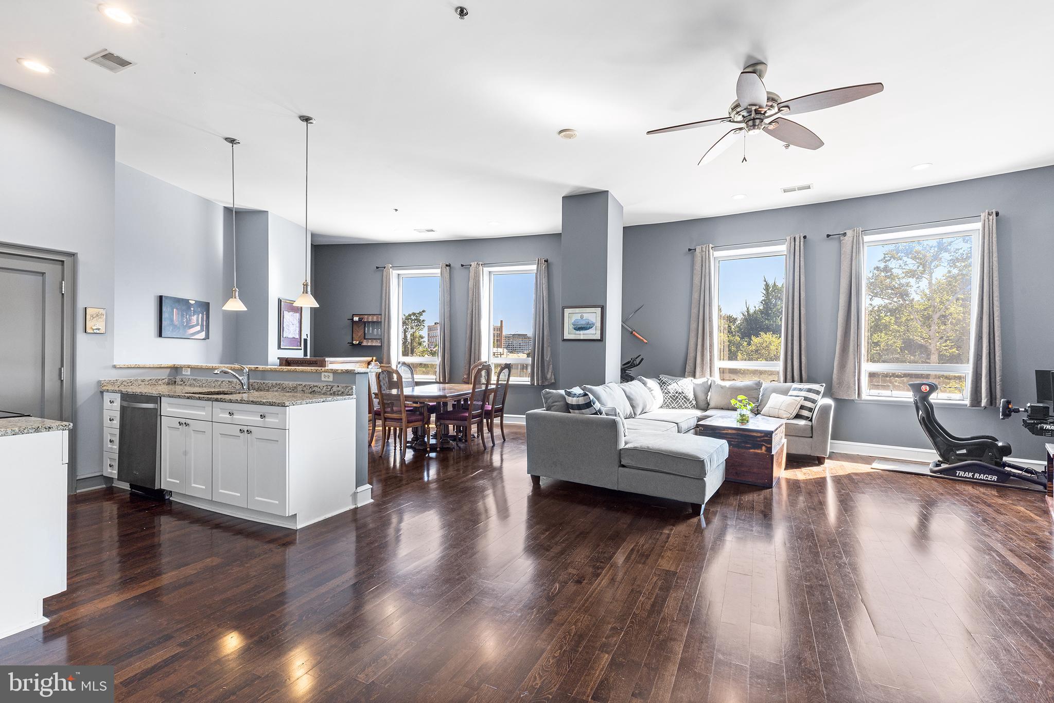 *SHOWINGS START 8/2* Welcome to The MetroClub #202! This massive (1431 square feet) 1 bedroom, 1 bath condo with DESIGNATED GATED 1-CAR PARKING exudes style in the heart of Philadelphia. A convenient hall closet and spacious entry way welcome you to the unit, but the soaring 13ft ceilings and oversized windows are the true show stopper as you enter this sun-drenched property. The espresso wood floors flow through the flexible, open layout which allows for multiple configurations of full size and even oversized furniture. Host dinners for 8 in the dining room or Eagles watch parties in the large living room. The flow of the space is made for entertaining (a bar on wheels can even be included in the sale)! The central kitchen has white shaker cabinetry, granite countertops and includes a pantry. The large utility closet houses a full-size washer and dryer, additional storage and rounds out the living space. The spacious bedroom boasts 2 more oversized windows (with blackout blinds) that overlook leafy Franklin Square Park. The bedroom can accommodate a king sized bed as well as additional furniture and has an en-suite bathroom. The sizable bathroom has double sinks with ample counter space, marble tile and a bathtub. Enjoy low maintenance living and countless amenities as a resident of the professionally managed, pet-friendly MetroClub. Top-notch amenities include 24-hour front desk security, bike storage, secure package delivery (Amazon lockers), updated common hallways and a fitness center. Additional storage lockers can be rented separately. The MetroClub also offers an incredible private pool and hot tub with cabanas and gas grills for residents (currently under renovation, estimated completion spring 2026). Centrally located with easy highway access (I-676, I-95), public transit (the new Franklin Square PATCO station is across the street and SEPTA is a few blocks away) and an Indego bike station- Center City living can’t get more convenient. Take advantage of the city’s award-winning dining, concert, brewery and festival scene. Old City, Chinatown, Spring Arts, Midtown and Center City- it’s all steps from The MetroClub, Philadelphia’s best kept secret. Schedule your showing today!