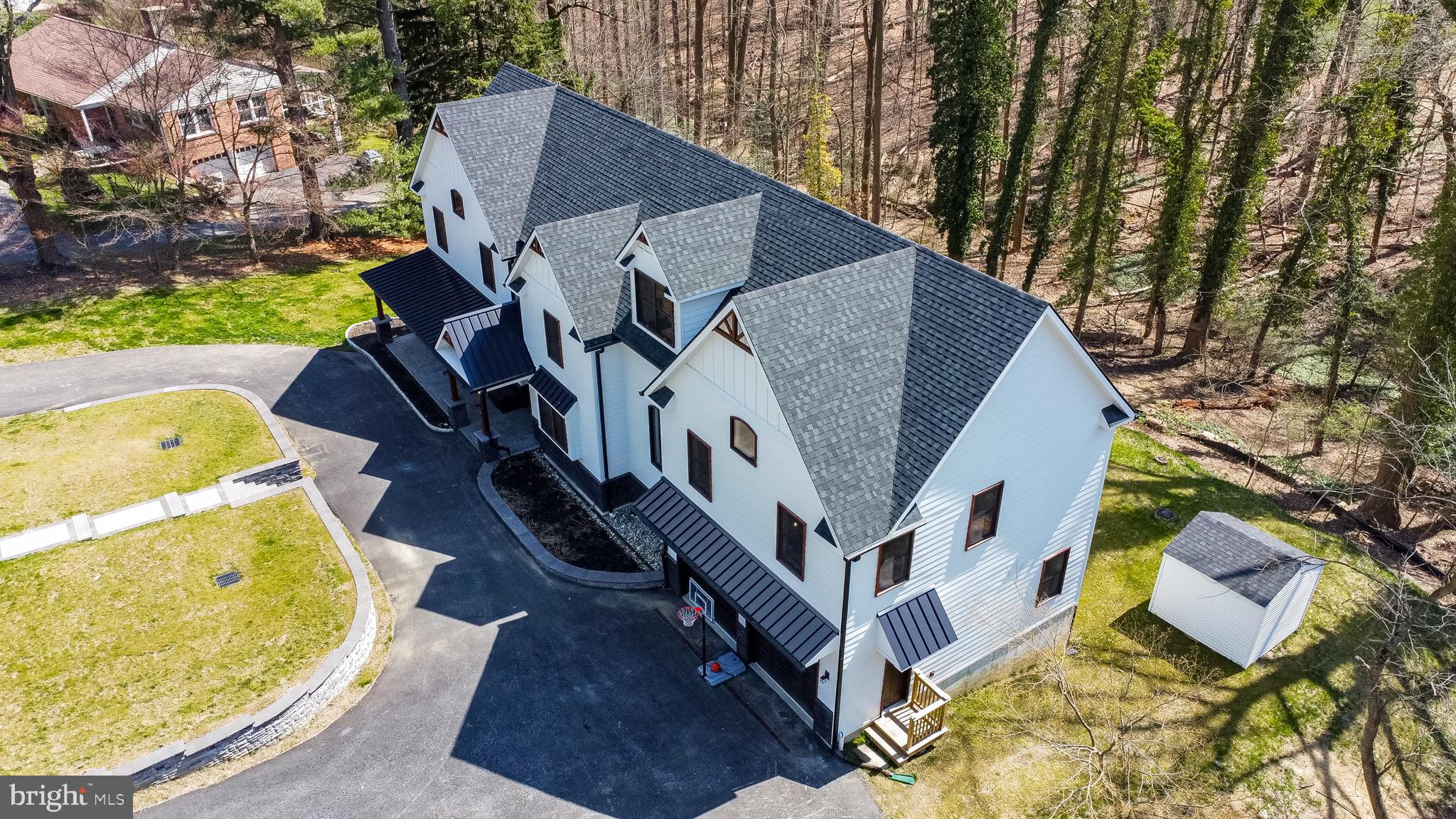 Stunning Modern Farmhouse in Rose Tree Media!! Newly built in 2021 and Tucked away on 2 breathtaking acres in a lovely established neighborhood, yet close to downtown Media , this custom built newer home is a fusion of rural tranquility and urban sophistication. Light filled and perched above the landscape with Tree House- like vibes, this home is extraordinary . Built with care and with exceptional attention to detail, the home is appointed with all of the latest on trend finishes including Black Marvin windows, James Hardie siding and timber frame detailing. The floor plan flows seamlessly from the gourmet kitchen to the spacious living room with floor to ceiling windows framing the landscape from above. The 1st floor features a HIGHLY sought after bedroom with en suite bath as well as an additional powder room and mudroom with built in cubbies. The primary suite features vaulted ceilings , free standing soaking tub and enormous custom fitted walk in closet The 2nd floor boasts 3 more large bedroom all with will in closets and en suite baths as well as a flex room that can be used as a second dedicated office and a large 2nd floor laundry room with folding table. The full finished walk out basement can house a large game room and has spacious under garage storage The Cat 6 wiring throughout for internet speed an efficiency as well as the Tesla charging station and on demand hot water are just a few of the amenities that make this home tech savvy, comfortable and energy efficient. Close to the train to Center City, centrally located between Wilmington and Valley Forge and just 10 minutes from the Philadelphia Airport , AND Located in prestigious Rose Tree Media Schools .. this is the one !!