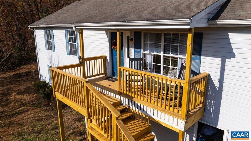 Welcome Home to Greene Acres! This beautiful home offers a perfect blend of comfort, style and outdoor adventure. The open-concept design, vaulted ceilings and abundant natural light create an inviting atmosphere, while the wood-burning fireplace and hardwood floors throughout add warmth and charm.  The large kitchen features ample counter space, storage, and an adjoining eat-in dining area that opens to a generous back deck?perfect for entertaining or simply soaking in the surrounding beauty. The primary suite is a private retreat, complete with walk-in closet and attached bathroom. Two more bedrooms and a hall bathroom finish off the main living space. The partially finished basement offers additional flexibility, featuring a fourth bedroom and rough-in plumbing for a full bathroom?perfect for creating additional living or recreational space to suit your needs. A single car garage completes the package, ensuring convenience and practicality. With access to a serene community lake complete with a fishing pier, sandy beach, and boat ramp, this property is your ticket to peaceful living.,Fireplace in Living Room