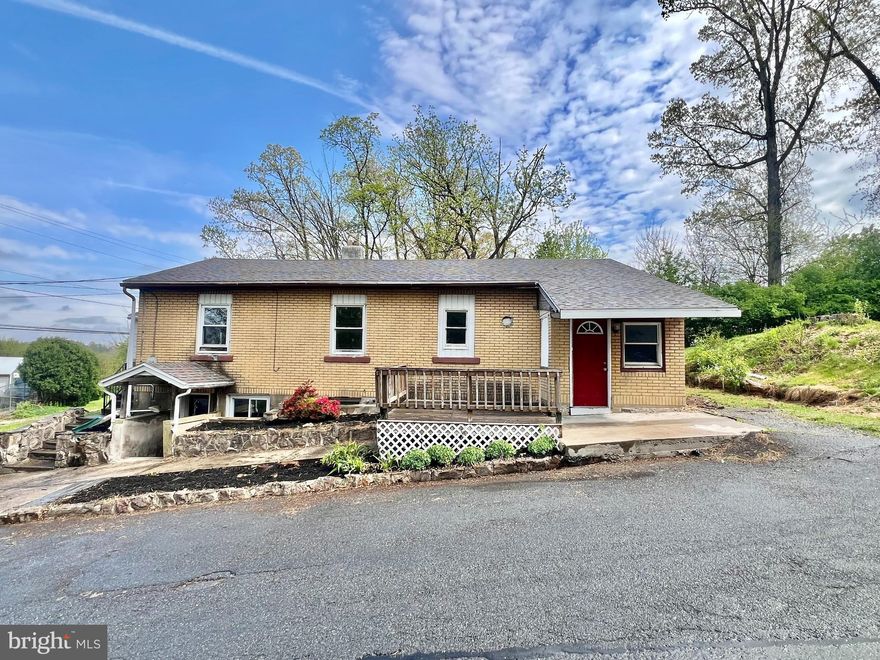 Welcome to this affordable single-detached, one-story ranch home situated on a corner lot in Muhlenberg Township, within the Muhlenberg School District.  The main level offers a spacious and thoughtfully laid-out floor plan featuring a beautifully remodeled wood kitchen complete with new white tile backsplash and durable tile flooring. A formal dining room, comfortable living room, and cozy den provide multiple living and entertaining spaces. Three generously sized bedrooms, with closets, a full bathroom, two welcoming foyer areas, and convenient first-floor laundry round out the ease of one-floor living. Access to the crawlspace attic is located through a first-floor doorway.  Hardwood floors can be found throughout a majority of the first floor.  The finished basement expands your living space significantly with a large finished area, ideal for a family recreation room, home office, or guest quarters, previously used as a fourth bedroom. This level also includes a spacious walk-in closet, a full bathroom, and houses the home's utility/mechanicals.  Step outside to enjoy the wood deck and large side yard, perfect for relaxing, entertaining, outdoor activities, or endless other possibilities. A private driveway provides off-street parking, and a storage shed offers additional space for tools and equipment.  The home's three front-facing entry-ways, two on the first floor and one to the basement, could lend itself to creative separate living spacious in the future.  The home has a newer roof and replacement vinyl windows.  With an affordable price, and even more affordable taxes (under $3600/year), this home provides a rare opportunity to own for less than what it would cost to rent!  Call us today to schedule your showing before it's too late!