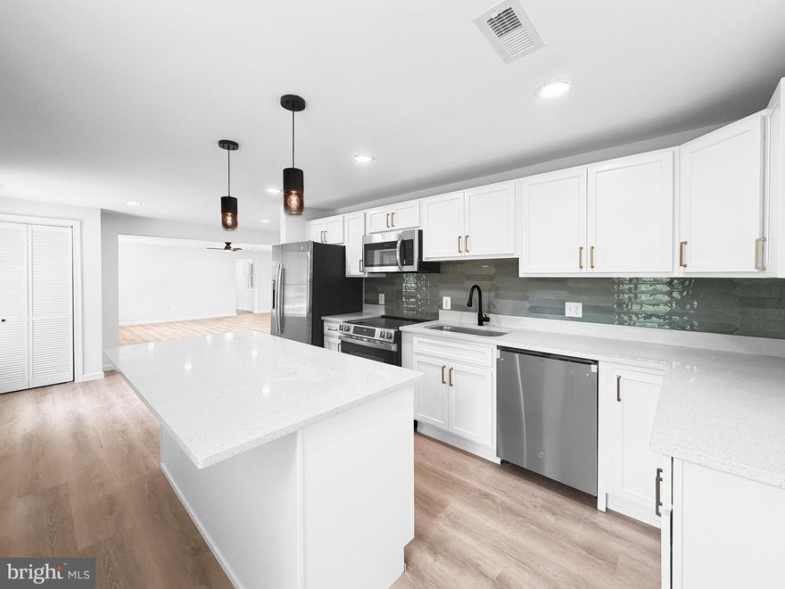 Welcome to this beautifully fully remodeled home, thoughtfully updated with modern finishes and quality craftsmanship throughout. The stunning brand-new kitchen is the heart of the home, featuring a spacious island, new cabinetry, sleek quartz countertops, and stainless steel appliances—perfect for both everyday living and entertaining.

Enjoy the durability and style of brand-new luxury vinyl plank (LVP) flooring that flows seamlessly throughout the entire home. A thoughtfully designed addition provides extra living space, offering flexibility for today’s lifestyle needs.

The spacious owner’s suite offers a private retreat with a fully updated en-suite bathroom, while the guest bathroom has been tastefully renovated and includes double vanities for added convenience.

Major updates include a brand-new roof, giving peace of mind for years to come. Situated on just under an acre, this property provides ample outdoor space to enjoy. All work has been properly permitted, including the well and septic, ensuring quality and compliance.

This move-in ready home combines modern upgrades with space and functionality—don’t miss your opportunity to make it yours!