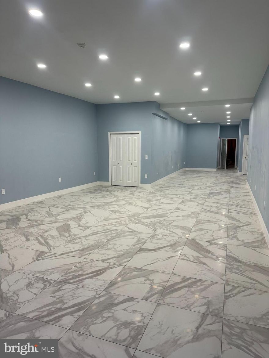 Recently renovated commercial space available for lease in the Frankford section of Philadelphia. Property features an open floor plan with high ceilings, recessed LED lighting, and new marble-style tile flooring throughout. Neutral paint colors and modern finishes provide a bright, move-in-ready condition.

The flexible layout is suitable for a variety of commercial uses including retail, office, showroom, studio, salon, medical, or service-oriented businesses. Additional rear space allows for storage or private office use.

Convenient location with good visibility and access to public transportation, major roadways, and surrounding residential and commercial properties.