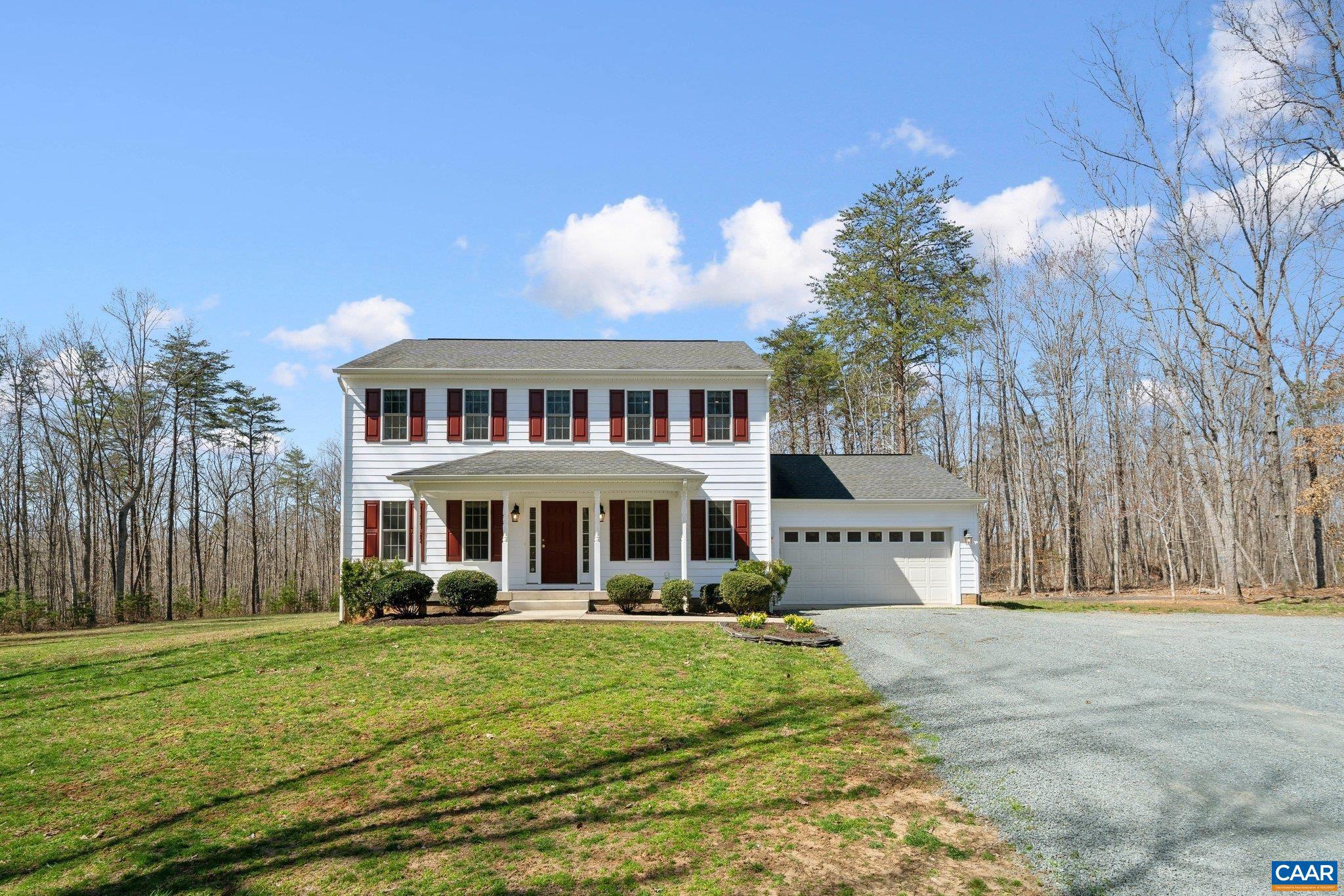 Great opportunity to own a beautiful home sitting on 23 acres, just outside of Charlottesville. This 3,000 square foot, colonial style home was built in 2010 and has 5 bedrooms, 3.5 bathrooms, an attached 2 car garage, and a full walkout basement. There are beautiful hardwood floors, conveying furniture, high speed internet, and an elevated rear deck. The 23 acres consist of wonderful hardwoods with many oak trees. This is a turn key opportunity. Located approximately 25 minutes south of Charlottesville, 5 minutes from Scottsville and the James River, and minutes from the Mount Ida Reserve Winery and Taphouse.,Wood Cabinets,Fireplace in Living Room