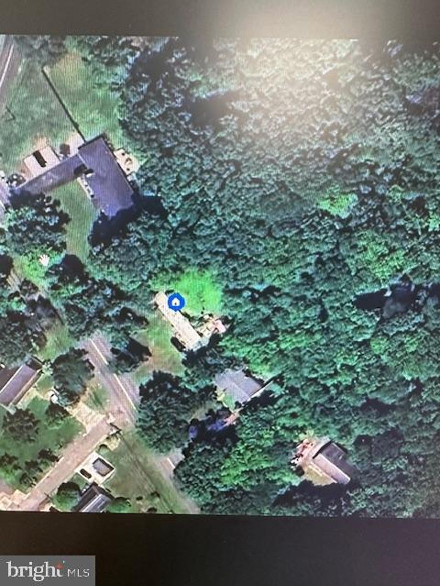 Mobile Home is a tear down but the value is in the land...Well situated parcel of almost 1/2 ac lot  w/  mature tree surround is ready for your Custom Home Design!  Situated close to Route 40, APG, 95 & Amtrak, that is convenient to all shopping/schools near by.  Public Water & Septic, so no issues with having to install a well/septic that is additional costs to deal with, zoned R2.  Buyer responsible for all utility hook-up & checking with Harford County design specs, NO builder tie-in, NO ground rent or HOA too!  Let your imagination run wild on what you can do to make this spot your next fantasy home.  **Sold As-Is (existing mobile home is vacant but Buyer is responsible for removal).  Required HOLD HARMLESS to be filled out prior to any showings, contact list agent for details.  Seller prefers working with Karas & Bradford to facilitate closing.