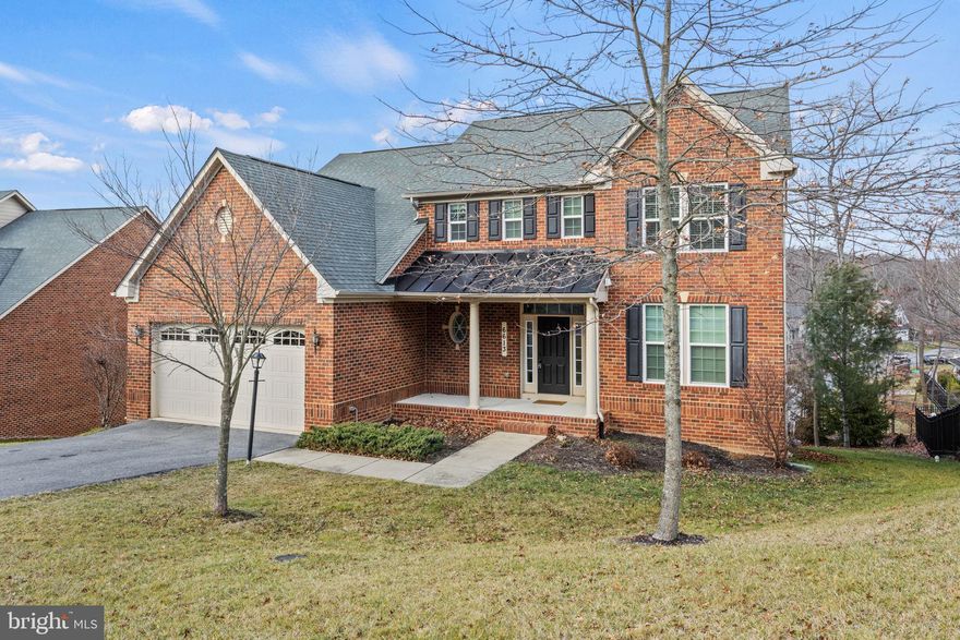 Welcome home to your stunning brick colonial in Aspen Village, located in the Lake Linganore community. With almost 4,000 square feet of finished space, this property features 4 bedrooms, 3.5 baths, and a fully finished basement. The front and back yard is perfect for barbequing on summer evenings, with two composite decks and an outdoor storage shed. Enjoy the amazing amenities of the HOA lake community, including two beaches for kayaking, canoeing and picnics, swimming pools, tot lots, dog parks, frisbee golf course, outdoor tennis courts, basketball courts, walking and hiking trails as well as year-round community hosted events. As you enter the main floor, a grand curved staircase and an open floor plan welcomes you. Entering the gourmet eat-in kitchen, you are greeted by the adjoining spacious yet warm living room with gas fireplace, overlooking the tree-adorned backyard and balcony . The formal dining space sits off the kitchen, which flows into an additional sitting area or possible office space. Custom hardwood floors, tray ceilings and wainscotting add to the elevated appearance of the space. A functional mudroom, half bath and laundry room complete the main floor and guide you to the attached two-car garage and additional 4 parking spots in the driveway. The second floor features a primary bedroom with a full ensuite, soaking tub, shower, his and hers sinks, and a walk-in closet. Additional features on this floor include an extra full bathroom and three spacious and light-filled bedrooms. The finished basement feels open and airy with 12-foot ceilings and includes a full bathroom, movie/media room with included TV and built-in sound system, additional living space, and a nook that could be used as a home office or additional storage.