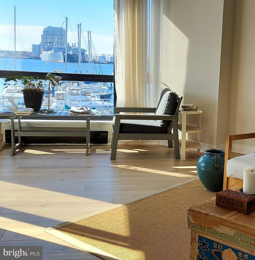 Bright and sunny waterfront condo available in the heart of Canton, within a stones throw of all basic
necessities. Recently updated with brand new half bath in the foyer, stainless steel kitchen appliances,
and fresh paint. Both bedrooms have full baths; the unit has a laundry room with a full-size washer and dryer; lots of closets and a separate storage room located on the same floor. It has TWO assigned parking spots in the attached, gated garage, as well as ample guest parking.The unit overlooks the waterfront promenade and a marina. The large balcony is perfect for entertaining or simply watching the boats and distant ships pass by. The balcony is accessed from a bedroom, the kitchen, and the living room. Exit the lobby and onto the promenade, where you can enjoy the paved path that runs along the waterfront. The building has a 24-7 attendant in the lobby, and secure key fob access to building and the parking garage. There are no barriers from the first floor of the parking garage to the building entrance. A no step entry into the lobby, elevators, and the interior of the unit has 30 inch doors throughout.

About the location:
This Canton condo is close to everything one might need without the need for a car. With a “Walk
Score” of 94 out of 100, the location is ranked a "Walker's Paradise" ; Directly across the street, is a
Safeway, Starbucks, shops, and restaurants. It's close to Fells Point (0.8 mi), and to Canton Waterfront
Park (0.5 mi) where you can hop on a water taxi to 6 different points in the Inner Harbor. The building is
on the JHU shuttle route and the city bus stops steps from the building.