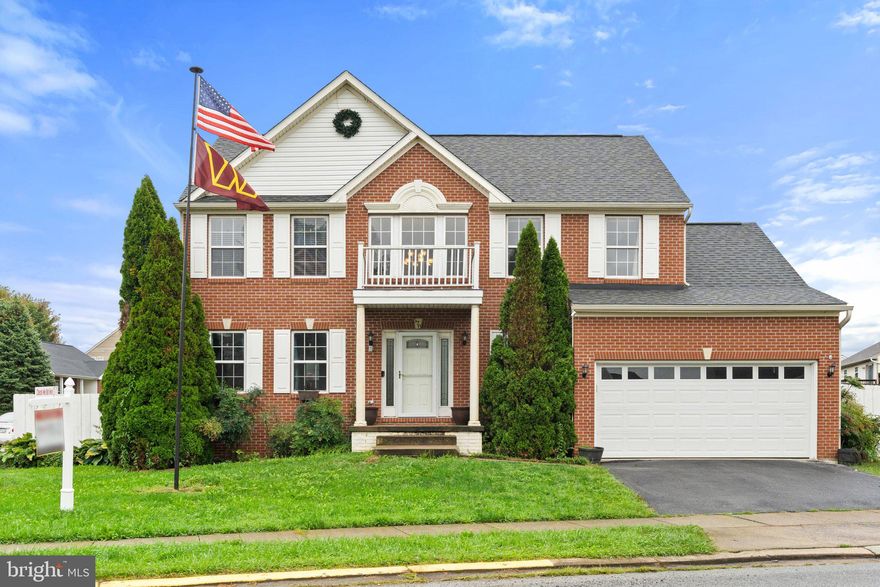 Welcome to this lovely brick-front Colonial, a true gem that seamlessly combines elegance, functionality, and modern comfort. Nestled on a corner lot with convenient access to WV-9 and US-340, this property offers the perfect blend of privacy and accessibility to in-town amenities. As you step inside, you are greeted by a grand two-story foyer, and the bamboo and hardwood flooring throughout the main level create a warm and inviting atmosphere. The open floor plan effortlessly connects the spacious living spaces, making it ideal for both intimate gatherings and larger social occasions. The heart of this home is the spacious eat-in kitchen, featuring stainless steel appliances and access to the rear deck. Upstairs, you'll find a generously sized primary suite that boasts a vaulted ceiling, a large walk-in closet, and a luxurious bathroom with a corner jetted soaking tub, tiled shower, and double vanity – a perfect place to unwind after a long day. The fully finished basement is undoubtedly the star of the show, offering a versatile space for entertainment and relaxation. It includes a recreational room, a bar area with a wet bar, recessed speakers, built-in shelving, and even a built-in aquarium. A locking hideaway wall storage unit ensures your belongings stay secure. Additional features of this property include a two-car garage with ceiling storage/shelving units, providing ample room for your vehicles and belongings. The privacy-fenced backyard boasts both a large composite deck and a concrete patio, creating an outdoor oasis for gatherings, barbecues, or simply unwinding in the fresh air. Don't miss the opportunity to make this remarkable property your new home!