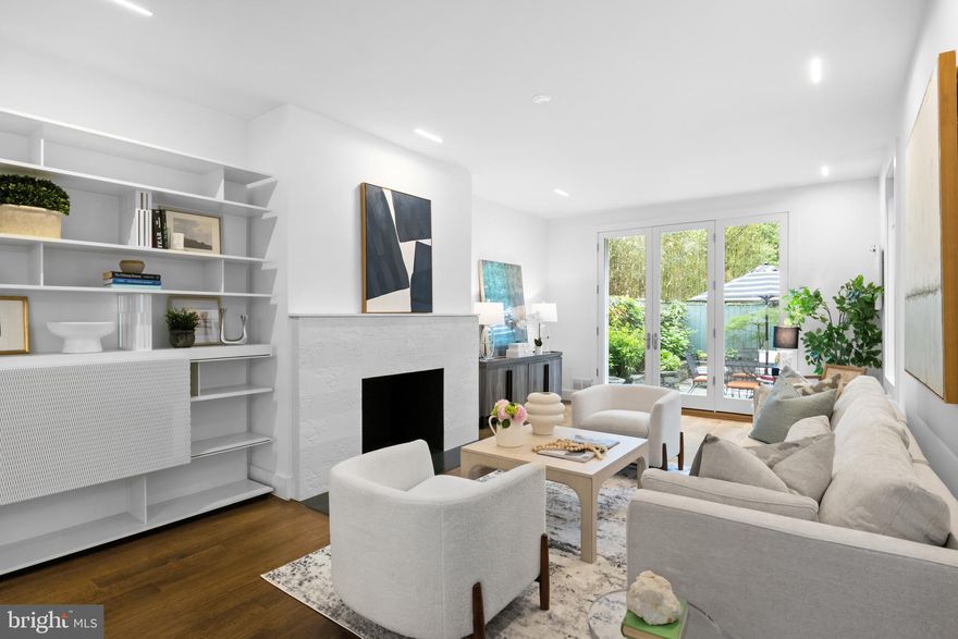 Stunningly renovated  5 bedroom, 4 ½ bathroom home spans over 4 levels and includes attached parking garage. Entryway adorned with original floral leaf crown molding and wainscoting-lined staircase. One level up on the main level, find the open and spacious living room with custom built-ins and Italian tiled fireplace mantel creating a warm hearth. A seamless marriage between the traditional and modern. 

Dining room area with capacity for a large table set alongside a custom sliding partition with geometric pattern allowing natural light to penetrate the living spaces.  On the other side find the impeccably designed and streamlined (Scavolini) chef’s kitchen with an abundance of storage and high-end appliances. Gleaming hardwood floors and sleek recessed lights throughout. Step out onto the rear private patio and lush garden - all in bloom.

Find the primary suite on the Upper 1 along with two large adjoining bedrooms, and an exquisitely tasteful and practical hall bathroom. Natural light radiates across the primary suite with original crown molding, double closets, and ensuite spa-like bathroom with textured tile and heated flooring. Watch the flowers bloom through the French doors which open onto the private Juliet balcony. 

The Upper 2 contains a sun-lit fourth bedroom and ensuite bathroom. Entry-level fifth bedroom with separate bath and updated kitchenette with granite countertops – new fixtures throughout. Chic half-bathroom conveniently located on the entry-level. 

Windows and patio doors replaced and refurbished in 2014.  Roof and skylight replaced 2021, HVAC (quiet) replaced in 2019, new water heater 2024. Primely located near Dumbarton Oaks, Montrose Park, Volta Park. A plethora of restaurants including Bistro Lepic and Patisserie Poupon just a block or two away. Retail shopping, Georgetown Waterfront and grocery all close by!