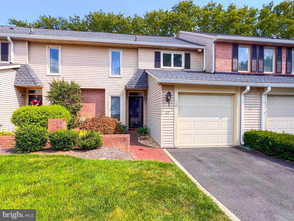 Welcome to 67 Sutphin Pines in the Awarding winning Pennsbury School District. This three bedroom two and a half bathroom home has been recently updated. Step into the foyer, with a coat closet, and notice the gleaming hardwood floors and open concept of the living room and dining room. View the enclosed outdoor patio space from the floor to ceiling four panel French doors in the dining area. Here you will also notice the mature tree lined rear yard of this home with no homes behind this property. The updated Eat-in Kitchen has newer granite countertops and Stainless Steel appliances. Also on the first level is a conveniently located half bathroom and an attached one car garage with inside access to the foyer of the home. The second level of the home has three bedrooms and two full bathrooms. The primary bedroom has a recently updated En-suite bathroom and walk-in closet with a newer organizational system. Completing the second floor are two additional bedrooms with newer flooring, a linen closet, and an updated hall bathroom with tub and shower combo. The lower level is mostly finished and includes a fireplace, TV viewing area, a bar area, laundry room, and utility/work room. Located near this well crafted home is the community pool, where you can relax and enjoy all that this home and community has to offer. Travel to work or for pleasure, Sutphin Pines is located near Route 1 and I-295, for easy access to Princeton, Philadelphia, and NYC. Yardley and Trenton train stations are also near by. Explore the historic areas near this home or take a walk along the Delaware Canal Towpath, then come home to your very own retreat.