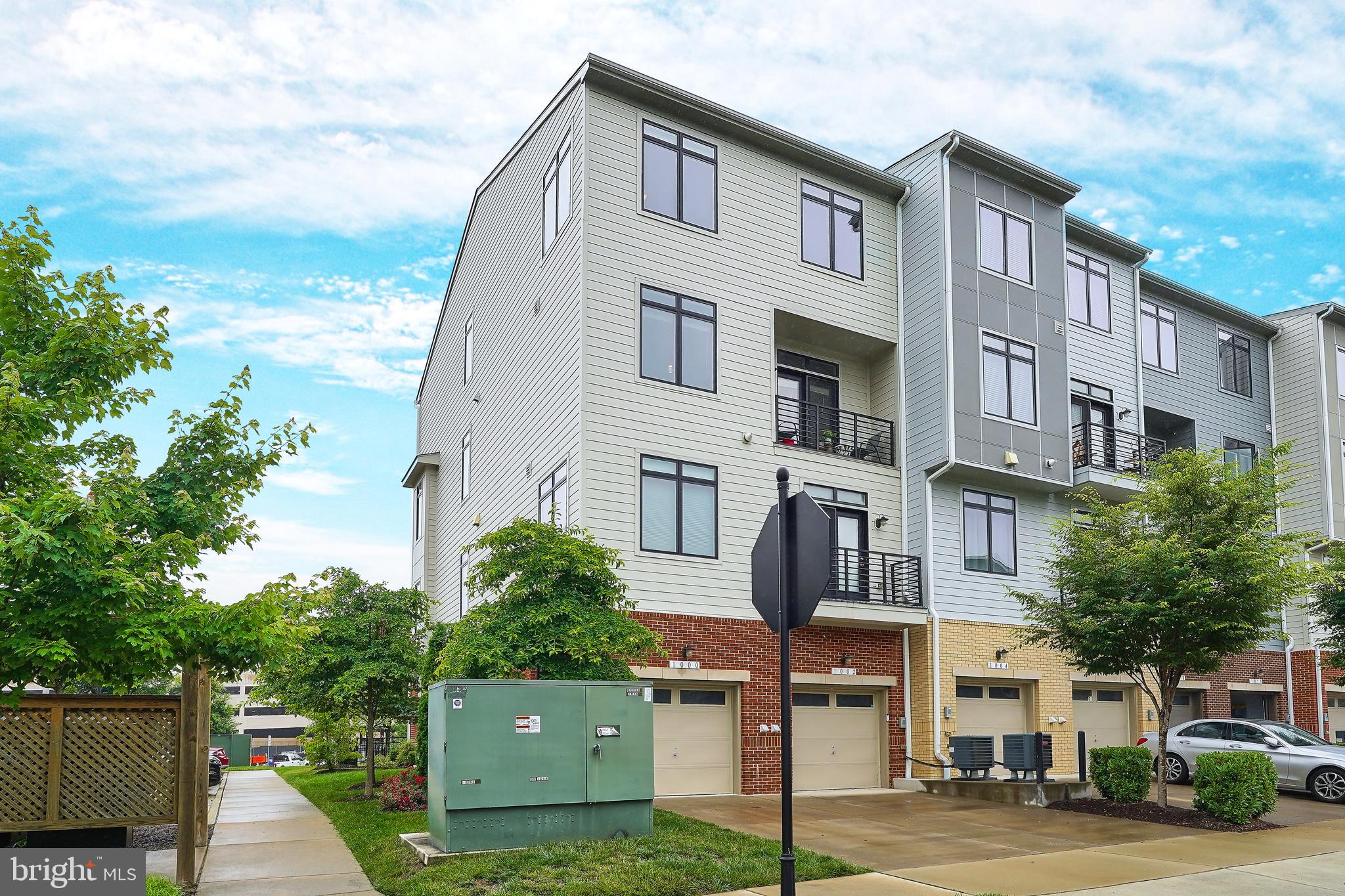 NEW PRICE - This one is a steal, so act quickly!
50% More Windows than interior units! Welcome to perfection in this stunning, END UNIT, move-in-ready upper-level 3-bedroom, 2.5-bathroom townhouse-style condo in the sought-after Lofts at Village Walk! No need to build or pay for upgrades—it’s all done here. This beautifully appointed home offers contemporary living with a bright, open-concept layout featuring high ceilings, crown molding, gleaming hardwood floors, and an abundance of natural light. The expansive main level seamlessly blends a gourmet kitchen, family room, and dining area into one impressive space. The chef-inspired kitchen includes stainless steel appliances, quartz countertops, an oversized center island with breakfast bar, large pantry, and both casual and formal dining options. Additional main-level highlights include a spacious Home Office, Powder Room, and custom touches throughout. Upstairs, the oversized primary suite boasts two walk-in closets and a spa-like en-suite bathroom with dual vanities, a soaking tub, and a walk-in shower. Two additional spacious bedrooms share a full bath, and the laundry is conveniently located nearby. Additional features include a covered front entry, private balcony, attached one-car garage with an extended driveway, and recessed lighting throughout. Located directly across the street from TONS of Food, Shopping and Grocery options at the vibrant Village at Leesburg—home to Wegmans, shops, restaurants, movie theater, bowling, and more—this home also offers easy access to Routes 7, 15, and the Dulles Greenway. Discover the ideal blend of style, space, and location.