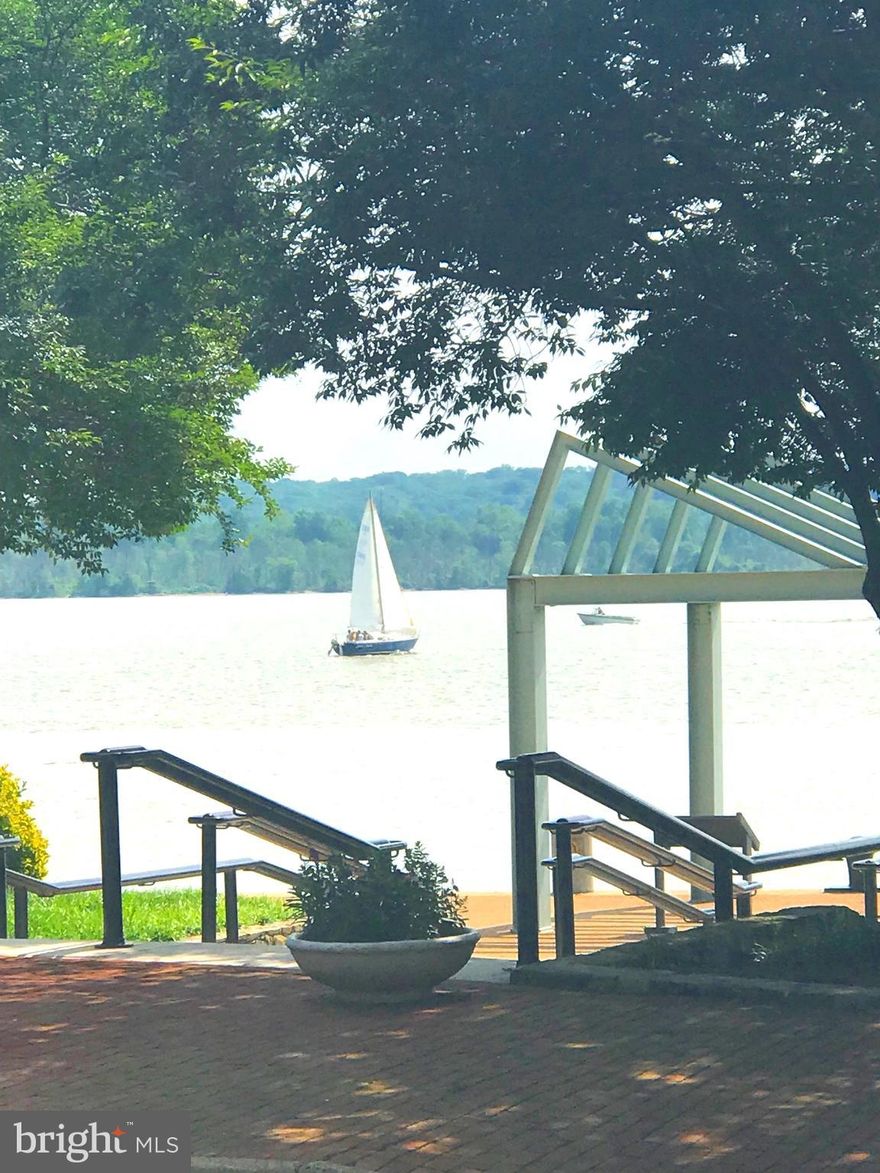 River views from every level are a must see!  Location location location!  SE quad 3BR/2BA and 2 half bath, with two car garage with plenty of storage, and premium floor coating.  Hardwood floors on all four levels. Stainless steel appliances, granite countertop with onyx backsplash.  Luxurious master bathroom remodel with quartzite & onyx finishes. Steps to boardwalk, walkable lifestyle.