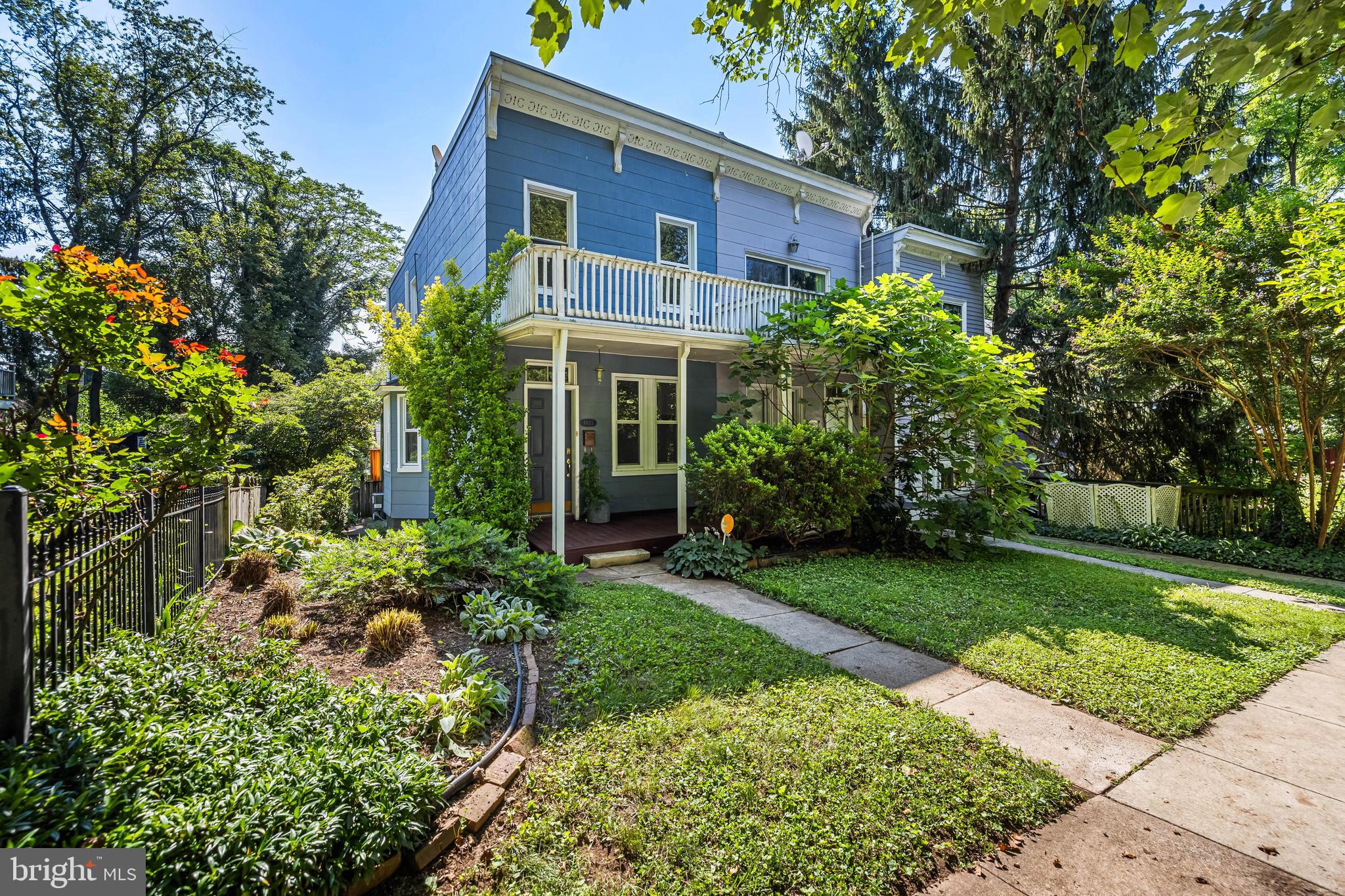 A Whimsical Retreat in Roland Park! Tucked into the leafy, storybook streets of the Evergreen enclave, this semi-detached charmer hums with peaceful energy and timeless character. Surrounded by mature trees and chirping birds, this home feels more like a woodland escape than city living. Step inside to a warm and inviting living room, grounded by beautifully preserved hardwood floors and drenched in natural light. The dining area continues the flow with rich wood tones and sunny exposure. The renovated kitchen blends function and flair, featuring custom wooden cabinetry, granite counters, a classic tile backsplash, and a cozy eat-in space for slow Sunday breakfasts. Upstairs, you'll find two thoughtfully appointed bedrooms, a hallway walk-in closet for all your treasures, and a stylishly updated full bath. Enjoy serene mornings on the welcoming front porch with views of lush greenery - ideal for birdwatching, a cup of coffee, or simply soaking in the calm of nature. The rear deck is an entertainer’s dream, overlooking a fully fenced backyard - a private oasis just waiting for your summer gatherings or quiet evenings under the stars. Practicality meets rare convenience with two-car off-street parking - a true luxury in this beloved neighborhood. Thoughtful owner updates include fresh paint (2025), kitchen refresh with new countertops, backsplash, and paint (2023), renovated full bath (2023), new water heater (2023), fully fenced yard (2022), and HVAC system (2019). Located just steps from Roland Park Bagels & Sandwiches and Miss Shirley’s Café, this home offers the perfect blend of neighborhood charm and accessibility. If you're craving a home with soul, serenity, and a touch of magic - this Evergreen haven just might be calling your name!