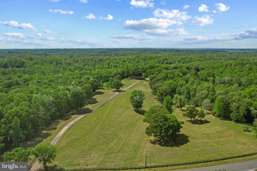Zoned Agricultural, his 55.67-acre (3 Parcels) property offers flexibility. The Seller used the property for a thriving Tree Service business, but it offers flexibility for a new Buyer. A private pond and creek add natural beauty and tranquility to the landscape, perfect for wildlife watchers and nature lovers. An additional parcel nearby with community water access rights to Potomac Creek and the Potomac River is available, featuring a boat ramp and day pier — ideal for boaters. 

It has a private oasis that combines modern comforts with rural charm, perfect for buyers seeking a retreat that is both tranquil and full of potential. A 4-bedroom, 2-bath bungalow with spacious main bedroom and spa-inspired bath is the heart of this property. The oversized main bedroom is a true sanctuary, featuring a walk-in closet and an attached bath with marble tiles, a double vanity, walk-in spa shower, and jetted soaking tub — ideal for relaxing after a long day. The kitchen is a chef’s dream, with a large central island, granite countertops, stainless steel appliances, and a Viking range hood (new motor 2023). The kitchen opens seamlessly to the family and dining areas, offering the perfect flow for entertaining or family gatherings.  Motivated Seller. 

Outside, the property is an entertainer’s dream. The hot tub and heated saltwater pool surrounded by beautiful decking create a peaceful space to relax or host friends and family. A pool house features a bar area with a sink, refrigerator, and ice maker, as well as a small kitchen, half bathroom, and poolside outdoor shower — perfect for outdoor gatherings or relaxing escapes. The high-bay shop building is a offers flexibility in vehicle and equipment maintenance with space for up to 7 large vehicles, a 10K lb lift, tool cages, a commercial auto vacuum, a restroom, and a wood stove for added warmth during winter months. The shop has a separate office area, with a half-bath, and a 900 lb ice maker. Under the same roof, there is a 2-bedroom apartment with walk-in closets, an eat-in kitchen, living room, and a washer and dryer — providing ideal space for guests or potential rental income.

The home has received several updates to ensure modern comfort, including a new architectural shingle roof (2025), a new heat pump (2023), and a new vinyl pool liner (2023). The exterior of the home is constructed with Hardie Board siding, known for its durability and low maintenance. Utilities include a private 8-inch drilled well (300+ feet deep) with a filtration and conditioning system, a 4-bedroom septic system (per seller), and 200 amp electric service at both the house and shop. Verizon FiOS high-speed broadband is available, a rarity in the area, providing excellent internet access for work or leisure.

This remarkable property is partially wooded, providing privacy and room to roam. The friendly Labrador dogs on the property will typically be secured in the shop office during showings, but they may bark to alert arrivals — they are not aggressive, but caution is advised. There is a lumber mill in a small shelter beyond the shop, which does not convey with the real estate sale but may be purchased separately if desired.

A perfect combination of work-near-home flexibility and relaxing retreat, this property offers the best of both worlds. Whether you're a car enthusiast, hobbyist, small business owner, or simply someone seeking a private sanctuary to enjoy nature, relaxation, and modern luxury, this offering is sure to exceed your expectations. Located just minutes from town conveniences, yet nestled in its own private world, the possibilities are endless. Don’t miss the chance to make this exceptional property your new home.
Additional Parcel Available with optional boat ramp access to Potomac Creek.
Potential Uses are suggestions, Buyer should confirm with County Board intended use.