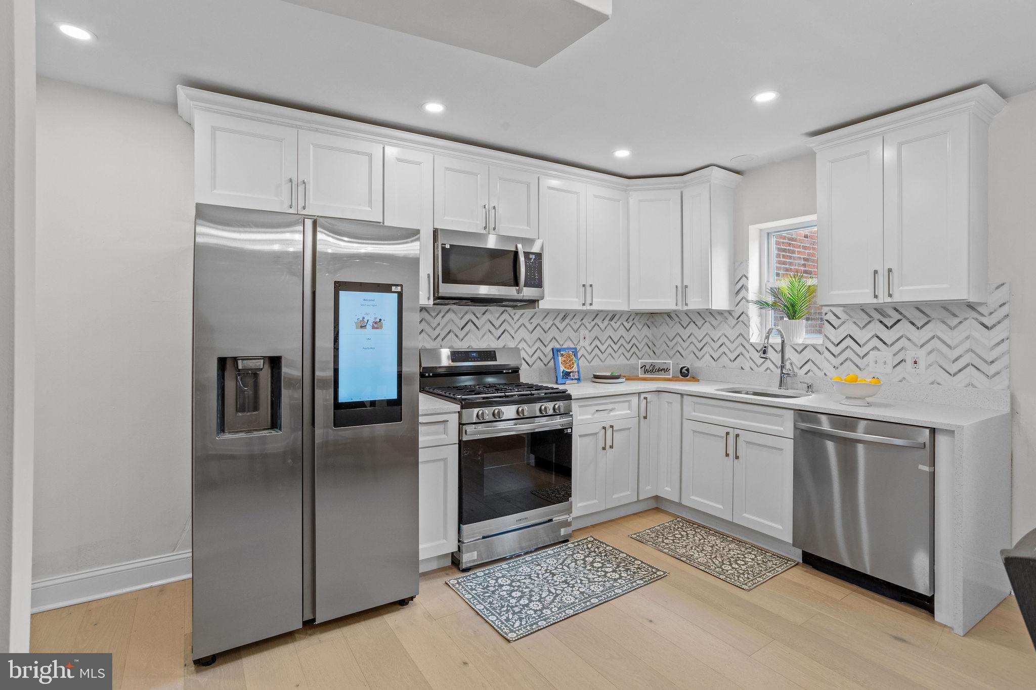 New open Kitchen, Freshly painted, New Flooring throughout, New Bathroom, New Powder Room, New Coating on Roof, Fenced front & rear yard, New Finished Basement. NEW Central Air Condition.