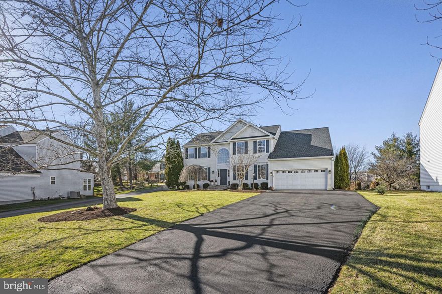 Tucked on a premium cul-de-sac in the heart of the sought-after Cascades neighborhood & Potomac Falls HS Pyramid, this spacious 4300SF+  4 BR / 2.5 BA home has the space, style, and location you've been waiting for. Pull up to the oversized driveway, enjoy the privacy of a front yard set back from the street, and step inside to soaring 9-foot ceilings, a dramatic two-story foyer, and elegant custom moldings throughout.
The kitchen is a true showstopper with a 5-burner gas cooktop, center island with prep sink, built-in ice maker, instant hot water, double wall oven, KitchenAid & Samsung appliances, walk-in pantry, and custom lighting inside and out. The family room flows right off the kitchen with a stunning floor-to-ceiling stone gas fireplace, perfect for entertaining. Rounding out the main level: a home office and an updated half bath.
Upstairs you'll find a spa-style primary suite, three more spacious bedrooms, an updated full bath, and upper-level laundry. The unfinished lower level with new epoxy floors is ready for whatever you dream up and already has a bath rough-in. Out back, a large deck and custom patio with built-in outdoor kitchen and grill make summer living easy. The Cascades HOA includes 5 pools, fitness centers, a clubhouse, tennis/pickleball courts, and trails. Minutes to RT 7, RT 28, Dulles Airport, top shopping and dining, Algonkian Park, and the Potomac River. The schools are right down the street.