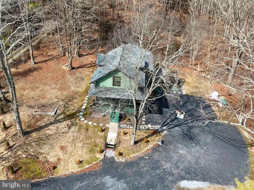 Fall in love with this fully renovated mountain retreat home in picturesque Strasburg, where modern elegance meets serene mountain living surrounded by the natural beauty of the Virginia mountains. Every detail has been thoughtfully upgraded to deliver true move-in readiness and peace of mind. This home features brand-new drywall, framing, insulation, plumbing, electrical systems, AC, recessed lighting, cabinets, and brand-new appliances , offering the comfort and reliability of new construction with the charm of mountain living. The final county inspection has been completed and fully approved, giving you added confidence and assurance. The open-concept kitchen is a showpiece, complete with upgraded cabinets and stunning quartz countertops that flow seamlessly into a warm and inviting living area, perfect for gathering with family or enjoying a quiet evening at home. Rich hardwood floors grace every room, while new oak stairs lead to the second-level primary suite featuring its own private bathroom and cozy sitting space , the perfect retreat for relaxation — overlooking the main living area and creating an airy, elegant feel. A thoughtfully designed addition enhances the home with beautiful new bathrooms adorned with ceramic tile, a reinforced foundation, upgraded siding, all-new windows, and a brand-new roof. Step outside onto the deck and breathe in the crisp mountain air while taking in scenic mountain vistas. With a fully updated septic system, modern convenience blends effortlessly with the beauty of nature. Here, mornings begin with breathtaking sunrises, coffee tastes better in peaceful luxury, and every evening feels like a getaway. This mountain retreat home is more than just a place to live — it’s a daily escape where comfort, craftsmanship, and the serenity of the mountains come together in perfect harmony. Don’t miss this amazing opportunity, it won’t last long!