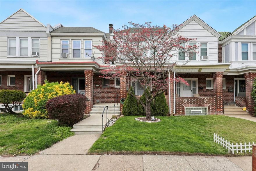 Beautifully Renovated Porch-Front Rowhome with Modern Upgrades Throughout!
This stunning home was completely renovated just a few years ago and feels brand new inside. The main level offers an inviting open floor plan with gleaming hardwood floors, a spacious eat-in kitchen with a peninsula island, and direct access to a cozy rear deck—perfect for grilling or soaking up the sun. A convenient half bath completes this level.

Upstairs, you’ll find three generously sized bedrooms, each with ample closet space and hardwood flooring. The full hallway bathroom features a dual sink vanity and a tub, offering both style and functionality.

The finished lower level provides a walk-out to the rear parking pad, which accommodates two vehicles, plus an additional storage shed. Inside, the basement offers versatile space for a second living area, extra storage, and a full bathroom.

Major updates completed during the renovation include new windows, HVAC, plumbing, and electrical systems—offering peace of mind and modern comfort. This is truly a move-in-ready gem!