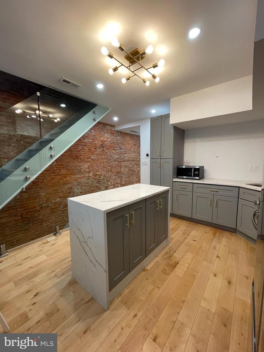 Welcome to 1205 S 4th Street #2 - available for move-in June 1! This 2 bedroom, 2 bathroom home resides in the Pennsport neighborhood of Philadelphia. This recently renovated home features an open concept living/dining space, spacious bedrooms, hardwood flooring, and a spacious private roof deck! The main level boasts exposed brick wall and glass  staircase. The beautiful chef's kitchen boasts gold fixtures, stainless steel appliances, and gray cabinetry. In close proximity to all of the restaurants, coffee shops, grocery stores, and parks that Pennsport has to offer, schedule your showing today!