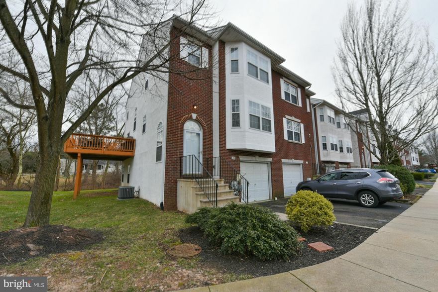 Quietly tucked in the Pine Tree Ridge Community, this beautiful end unit is in an ideal location! With it's open floor plan concept and neutral colors, the space and flow allows for easy living! The Great Room with it's spacious  Living Room and Dining Room makes large gatherings possible! Just off the Dining Room is the generously sized  eat-in kitchen with updated appliances and hardwood floors for easy maintenance. The laundry is discreetly tucked in a closet. And the sliding glass doors open to the spacious deck with awesome views! The Weber grill is staying, so start planning your bbq's! The lower level boasts a rec room with a french door to the quiet backyard that backs to woods. There is a powder room on this level, and the entrance to the one car garage. The upper level provides the Master Bedroom, with a walk-in closet, bay window and a full Master Bath with a shower stall. The second bedroom comfortably holds a full bed, and the third bedroom easily holds two single beds. The hall bath has a tub for the little ones.   Brand new heater and central installed in 2018. Having the extra wall of windows provides more natural light and a feeling of openness. Shopping is a quick walk away, with the areas finest restaurants also close by. Super quick access to major routes, if you need convenience, this is the home for you! Monthly community fee includes trash and recyclables, snow removal and lawn maintenance. No set parking spaces, so if you have more than one car, you're fine! Schedule your showing today!