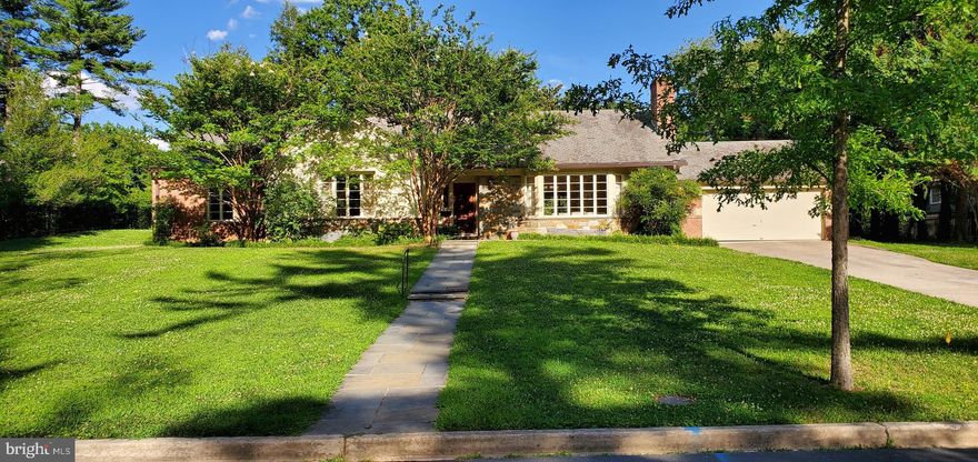 ATOP THE HILL! Rare opportunity to purchase Spring Valley's most quintessentially located property of over  a 1/2 acre. Perfect for renovation or new build. Large, WC & AN Miller, Tudor-influenced rambler contains 3 spacious BRs, 3 full BAs, 2 half BAs, 3 adorned, wood burning fireplaces and original hardwood floors. Abundant, natural light ebbs and flows within the structure. Embassy sized living room is graced by bow windows and fireplace. Formal dining room houses commanding folding doors, built in cabinets and overlooks an extensive slate patio. Generous sized kitchen redefines galley style - has ample 'T' space for casual meals and, a swinging door. Handsomely appointed study is at the heart of the house containing its own fireplace, powder room, custom bar, bookcases, bow windows and direct entrance to adjoining slate patio.  Large sliding-glass enhanced porch, oversees the backyard beyond with slate patio, stairs, retaining wall and raised knoll - it can be accessed by kitchen, dining room and lower level. Expansive attic and lower level with half bath and fireplace, lend themselves to the generation of even more living space!!! A HOME FOR LIFE!  Thank you for wearing a mask while viewing. Open House Sunday - 7.19.20, 2 - 4 PM Sold As Is