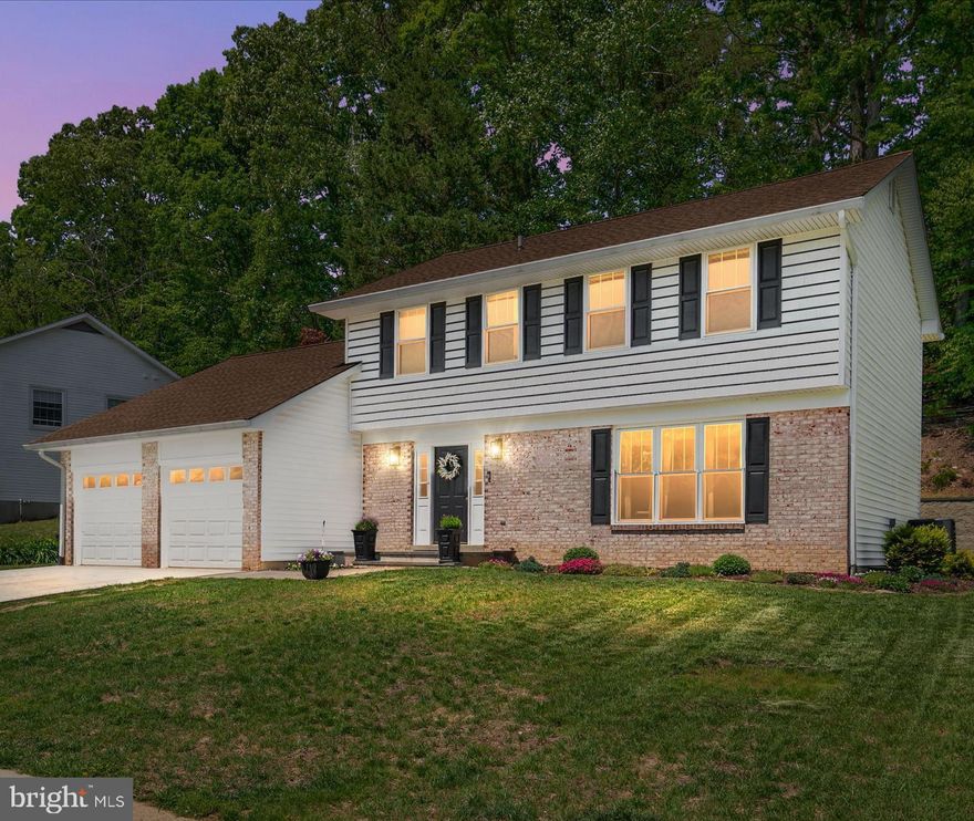 Welcome to 397 Westbury Drive, an impeccably updated 4-bedroom, 2.5-bath colonial in the highly sought-after, water-privileged community of Annapolis Landing. Showcasing an extensive list of meticulous recent home improvements, this property is a true turnkey standout.
Step inside to a beautifully remodeled open-concept main floor featuring top-quality luxury vinyl plank flooring, upgraded wood baseboards, and custom window and door trim. The gourmet kitchen is an entertainer’s dream, boasting custom solid maple cabinets, quartz countertops with a custom backsplash, and a stunning Amish-made center island with a granite top. It comes fully equipped with a stainless steel farm sink, custom undermount lighting, and high-end GE Profile appliances, including an upgraded gas range.
The kitchen flows effortlessly into the living and dining spaces, leading out through a new sliding glass door to a fantastic backyard oasis. Here, you can relax on the custom deck featuring composite decking and built-in seating, or gather around the nearby fire pit on the lush, manicured lawn.
Upstairs, you will find three generously sized bedrooms alongside fully remodeled primary and second-floor bathrooms. The fully finished basement adds incredible flexibility, showcasing a custom shiplap wall feature and beautiful luxury vinyl plank flooring throughout a sprawling recreation room. This lower level also boasts a dedicated bedroom currently used as a home gym and a massive laundry room outfitted with extensive shelving, a stainless-steel utility sink, and a new washer and dryer.
Major big-ticket exterior and mechanical updates have already been handled for you, giving you total peace of mind. The welcoming front facade features charming brick accents and a newly widened concrete driveway leading to a two-car garage with new LiftMaster electric openers. Additional upgrades include new house siding, new windows throughout, and extensive landscaping with front and backyard grading.
Beyond the home itself, aerial views highlight Annapolis Landing as a picturesque, heavily wooded neighborhood with quiet, tree-lined streets. Located on Beard’s Creek just off the South River, this active community features a private waterfront park, a marina with 62 boat slips, a transient pier, a boat ramp, and racks for dinghies, kayaks, and canoes. Neighbors frequently gather for beloved community events like the annual Spring Sock Burning, summer raft-ups, and "Docktails" happy hours.
With pristine upgrades, beautiful outdoor living spaces, and convenient commuter access to Annapolis, Baltimore, and Washington, D.C., 397 Westbury Drive isn't just a house—it's the lifestyle you've been waiting for!