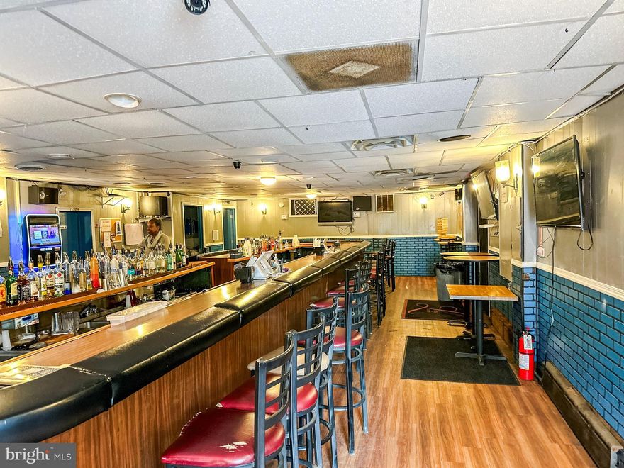 HUGE PRICE REDUCTION!!Unique opportunity to purchase property and business and make it your own. Business includes OFF/ON TAP LIQUOR LICENSE. Only 4 establishments in Delaware have such a license.  The sale also includes the PARKING LOT which includes 9 city lots. Established in 1972 LeRoy's Lounge has a long-standing history in the City of Wilmington.  The business includes the bar and adjacent package store.  The first floor where business is located features huge oval shape bar, 2 bathrooms, package store and storage areas. There are 2 additional unfinished floors that present a great opportunity for new owner with a vision. Property has great visibility being a corner lot. The rear of property has 2 garages, shed and small yard.  For the right buyer this is a diamond in the rough.  Property is being sold AS-IS condition. All reasonable offers will be considered. Call and schedule a private tour today.