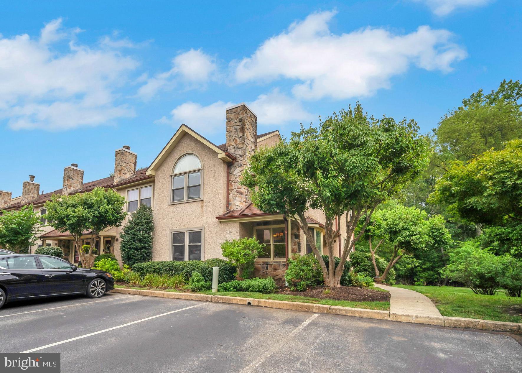 An ideal Bradford Hills End Unit Home offers a tasteful private corner nestled in mature trees and landscapes located in this desirable Chesterbrook community within Tredyffrin/Easttown Schools. This expansive end unit offers 4 bedrooms, 2.5 bathrooms, a finished walk-out basement, and is available immediately for occupancy. Upon entering you will first notice the open floorplan and natural light. The main level features a formal living room and dining room with hardwood flooring, that then opens up to your gourmet kitchen and family room combination. Off of the eat-in kitchen, you can entertain your guests on the private large deck with private views of the green space behind the property. Completing this level is a half bathroom, and large pantry. Upstairs, you will find your primary suite with vaulted ceilings, large walk-in closet, and en-suite bathroom featuring dual vanities, standing shower, and tub. Also on this level are two bedrooms, a full bath in the hallway, as well as your laundry closet. Upstairs you will find your 4th bedroom, perfect as a guest space or home office. The walk-out lower level is a fantastic bonus space and also has a large unfinished storage room. The property has been freshly painted and is ready for it's next occupant. The open parking lot provides multiple parking spots for you and your guests. Inquire today!