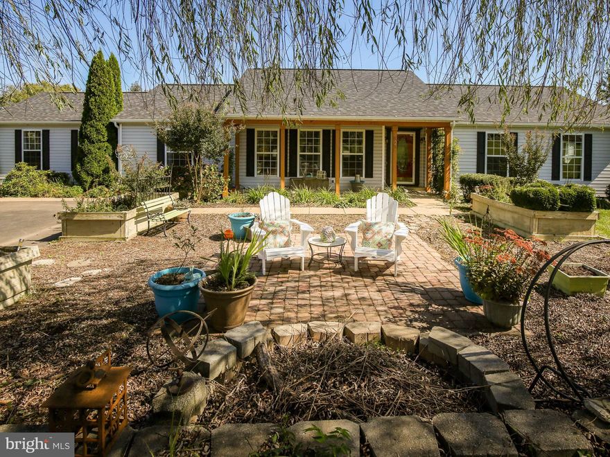 Make the move to the country, but still live in a neighborhood with shopping nearby!  Spacious, bright and sunny one-level rancher on just over 2 acres has been lovingly groomed for indoor and outdoor enjoyment.   Enjoy stunning sunrises over the mountain from the new 12 x 32 deck with pergola or a gorgeous sunset from the front porch and courtyard with 12x12 paver patio and fire pit.  Have great adventures without leaving home - backyard campouts, fireflies, star gazing and the antics of the neighbors horses!  Plenty of room to spread to work or learn virtually without being on top of each other with flexible living spaces and generously sized bedrooms.  The one bedroom in-law suite with kitchenette and it's own entrance can be closed off from the rest of the home or left open as a home office, school space, craft room, rec room – whatever you need. Cozy window seat in the kitchen with brand new LifeProof flooring, stainless appliances and recessed lighting overlooks the back yard and is a great spot to sit to watch it snow. Do you feel like you spend your life doing laundry? The huge sunny laundry room will make it a pleasant task.  Don't let the fact that this home is on a crawlspace be a limiting factor - the 40x64 barn/garage with concrete floor and electric is better than a basement: storage, parties, workshop, or to get that person who insist on learning electric guitar and drums out of the house but still keep an eye on them. Covenants allow for horses (and sheep and cattle) so if your pet preference runs on the large side this is the spot for you. Low street traffic makes this a great neighborhood for walking, biking, running – you may even encounter a horse and rider. NEW HVAC in 2020. NEW roof, deck, and pergola in 2019. Xfinity internet is available. Seller is a licensed real estate salesperson.