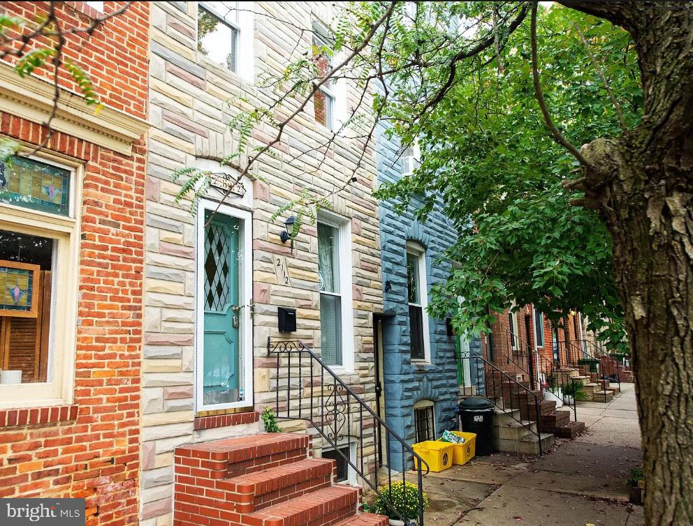 Only a few blocks from Patterson Park this 3 story row home is conveniently located between and Canton and Fells Point. Once you enter the home you'll be welcomed into a sitting area and separate living room with hardwood floors and exposed brick walls. The main level is also complete with a half bath, dining room, updated kitchen, full bathroom and access to a back patio. The 2nd floor features a generously sized bedroom, laundry area, full bathroom with 2 separate vanities and a potential 4th bedroom with French doors that is currently being used as an office space. Two additional bedrooms are situated on the third floor! Lease is available starting in the beginning of March!