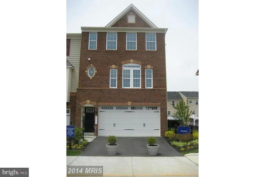 Spacious Ryan Model End unit Town Home w/ too many upgrades to list. Open concept on the main level w/ hardwood flooring. Entertain in the FM RM w/ 3 sided Gas FP & Gourmet Kitchen w/ granite counter tops. Master Suite w/ walk-in closet, soaking tub & double sink vanity. Easy outdoor entertaining on the Large Deck and stamped concrete Patio. Large two car garage and driveway for plenty of parking