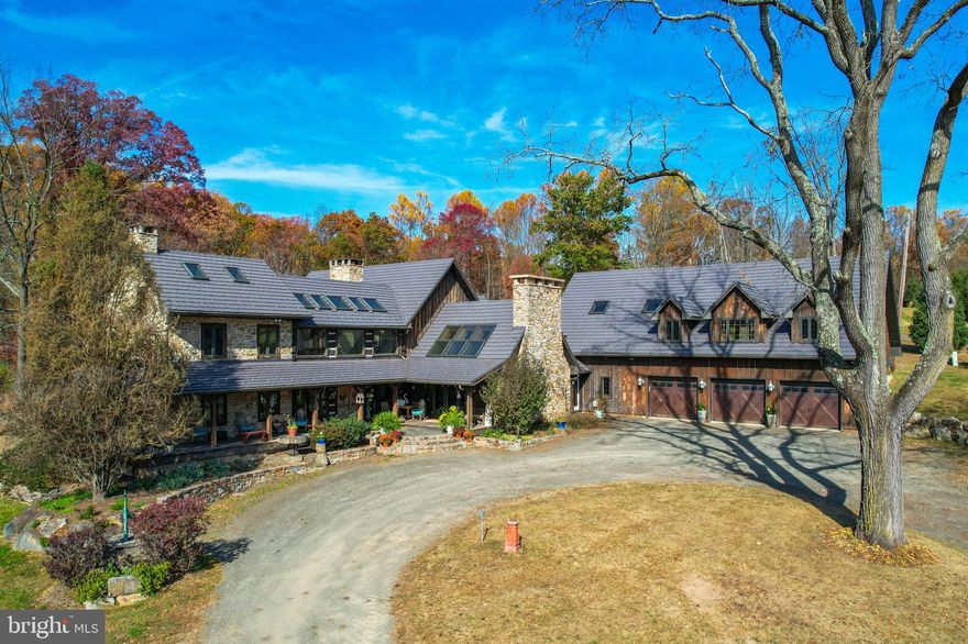 Welcome to Water & Wings the historic homestead of Theobald Mechling Circa 1730.Original land grant was signed by the sons of Wm Penn.Boasting 214 acres of rolling hills,scenic mountains,pastures & native trout stream.The main home includes 7,500 sq ft of impeccable open concept design including beams,flooring & trim made from wood on the homestead cut on a portable saw mill.Extensive stone work & 5x5 through wall walk in FP that can be viewed from all rms on the 1st flr.Professional kitchen w/ wood fired pizza oven,GE professional appliances & a mud room w/ large pantry, freezers, refrigerators and newly designed full bathroom w/ room for additional washer & dryer waiting to be finished.Furnishings include custom forged sconces, chandelier and light fixtures.Skylights throughout the home bring the outdoors in along with wrap around porches and custom decks all of which highlight the views of the outdoors;add to this custom made spiral stairs & balcony railings from tree branches & this makes for one of a kind home.3+ car garage w/ 40x60 room above garage waiting to be finished.Carriage house structurally restored & consists of 3 stalls,2 round top door carriage section and tack rm attached to a 25x60 wood shed that houses the custom wood burning system for the main home.2520 sq ft 6 BR,Caretakers home believed to be the original homestead w/ log structure,covered with old German clapboard.Fully renovated 1200 sq ft bunkhouse,being used as office w/kitchen,loft BR & full BA