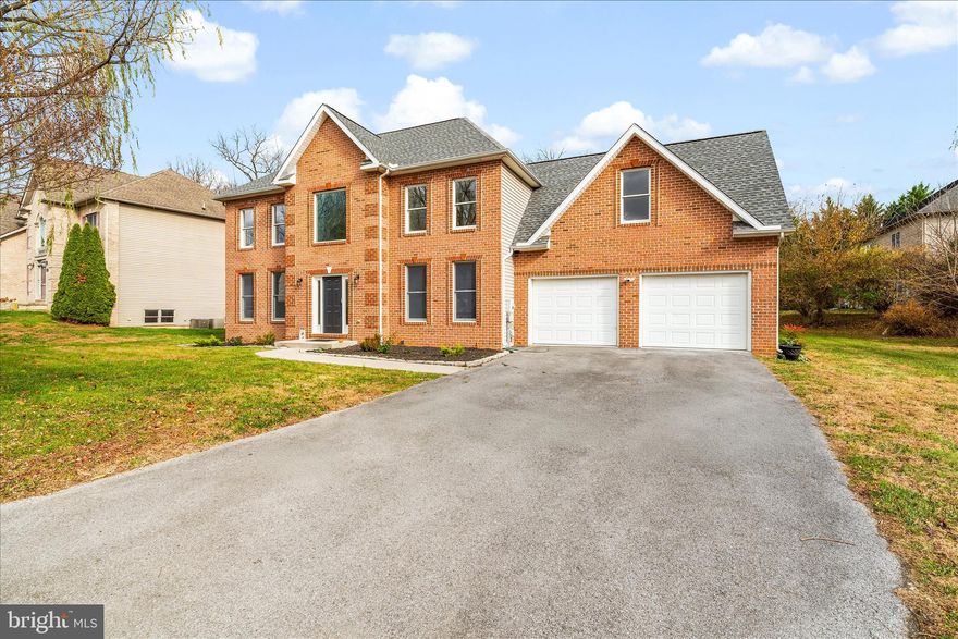 This is a must-see opportunity! One-of-a-kind updated brick home located in the peaceful Woodbridge neighborhood. This 4-bedroom, 3-full-bath home offers the perfect blend of a modern open floor plan with the classic charm of a colonial-style home. You are greeted by the grand two-story foyer that leads into the remodeled kitchen, which includes full new cabinetry, gorgeous granite countertops, and a farmhouse sink.  The nine-foot ceilings give an updated feel while maintaining the classic dental molding that you will not find anywhere else. Gleaming hardwood floors lead you into the great room, the formal living room, and the formal dining room. The upgraded fireplace creates a cozy focal point, and all light fixtures, mirrors, ceiling fans, and the foyer chandelier have been tastefully updated. Contemporary railings with metal balusters lead you upstairs to four oversized bedrooms, including the spacious primary suite. Tall windows for natural light, a large walk-in closet, and a luxurious en-suite full bath with a nickel-gap accent wall create an amazing primary oasis for the owners. Each additional bedroom is generously sized. The main-level full bath has been completely remodeled, and all faucets, sinks, and bathroom fixtures throughout the home have been upgraded. The laundry room features newer appliances with a warranty still available. On the exterior, you’ll enjoy the private patio, a rear Andersen aluminum-clad French door, and a rear garage door with built-in blinds. The garage has been enhanced with new cabinets, insulated efficient door panels, and a code-compliant Tesla charger with a multi-use EV charging outlet. This home is virtually maintenance-free with an upgraded furnace, EcoSmart thermostat system, newer roof, and fresh paint throughout the house. Easy access to major commuter routes, the Robinwood Medical Center, shopping, and dining complete the package. Not to mention top rated schools!