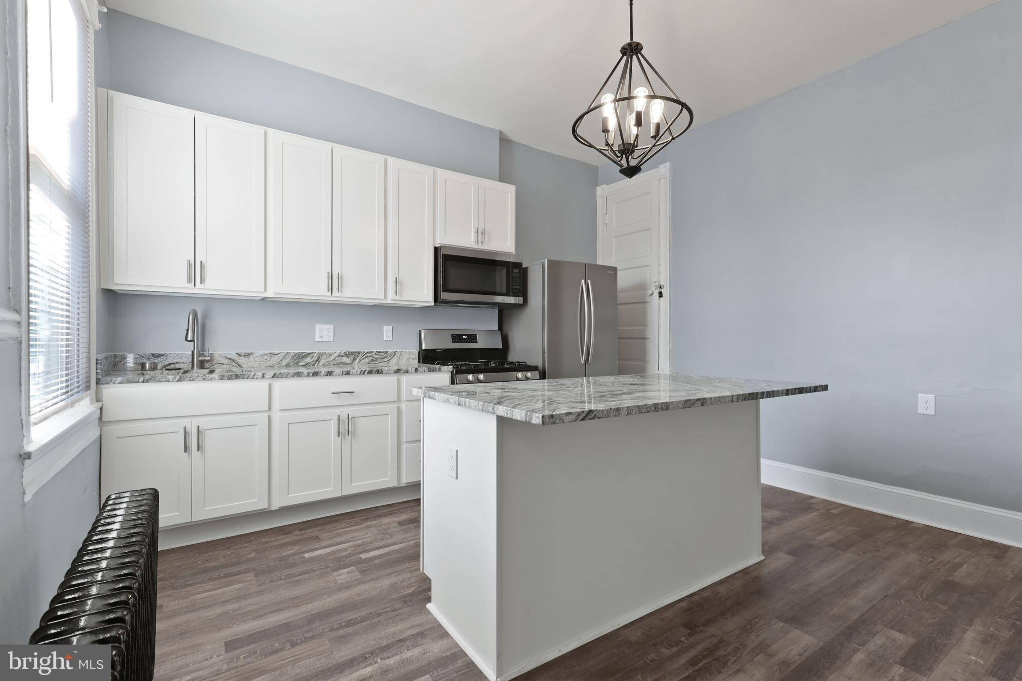 Fully renovated, first level 1,000 SQFT 1 Bed / 1 Bath unit with double wide family room, 12+ ft ceilings, oversized pass-through closet with built-ins, and rear parking! Calvert is one of the largest updated 1 Bedrooms available and is located in the heart of Charles Village, blocks from Wyman Park and JHU. Pets on case-by-case basis. Water included. No washer / dryer in unit. Background + credit $25/applicant. Available immediately!