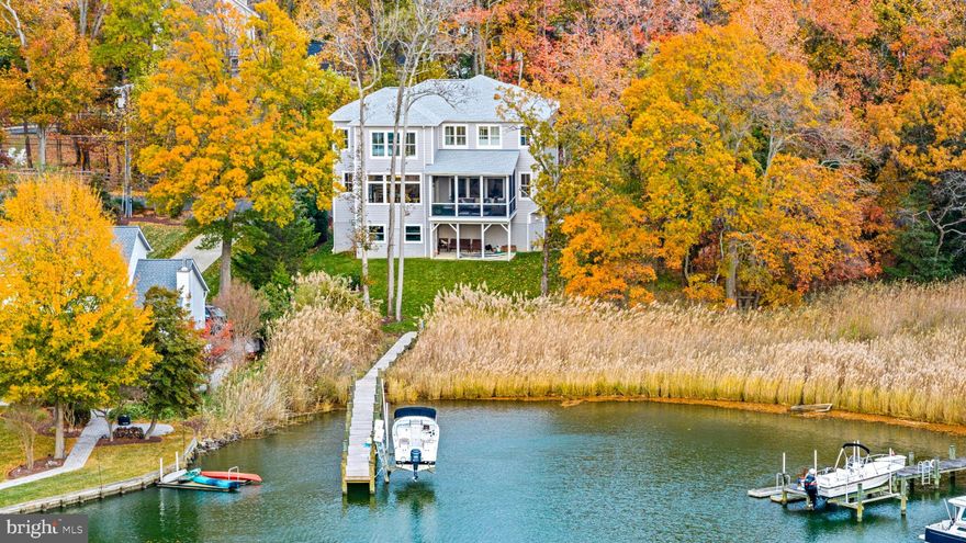 Come explore the shores of Bay Ridge. As Annapolis's premiere waterfront community, Bay Ridge boasts an Olympic-sized swimming pool, a marina with 120 slips, and a private clubhouse. Serving as home to the Chesapeake Bay Foundation, this community stewards and embodies all of the finer aspects of living on the Chesapeake. With miles of shoreline, private beaches, and breathtaking views, Bay Ridge has become the preferred place for generations of families to call home. Annual parades, festivals, and community events fill the calendars of the welcoming residents and guests alike. This neighborhood is where everyone wants to call home. Completed in the Fall of 2022, this home has served as a model for Whitehall Building & Company, Annapolis' largest waterfront home builder. Comprising 5k sq. ft. of space under roof, it includes 4k sq. ft. of finished space, an oversized 3-car garage, 5BR, and 5.5 baths. The Elevator, walls of windows, and well-appointed finishes of this luxury residence will appeal to buyers from all generations. Completing this offering is a well-groomed, large .44 acre meticulous yard with WIFI irrigation leading to a new pier and 10k lb remote-controlled boat lift. (See video. Sale includes both 90 and 92 E Lake lots which house is built on)