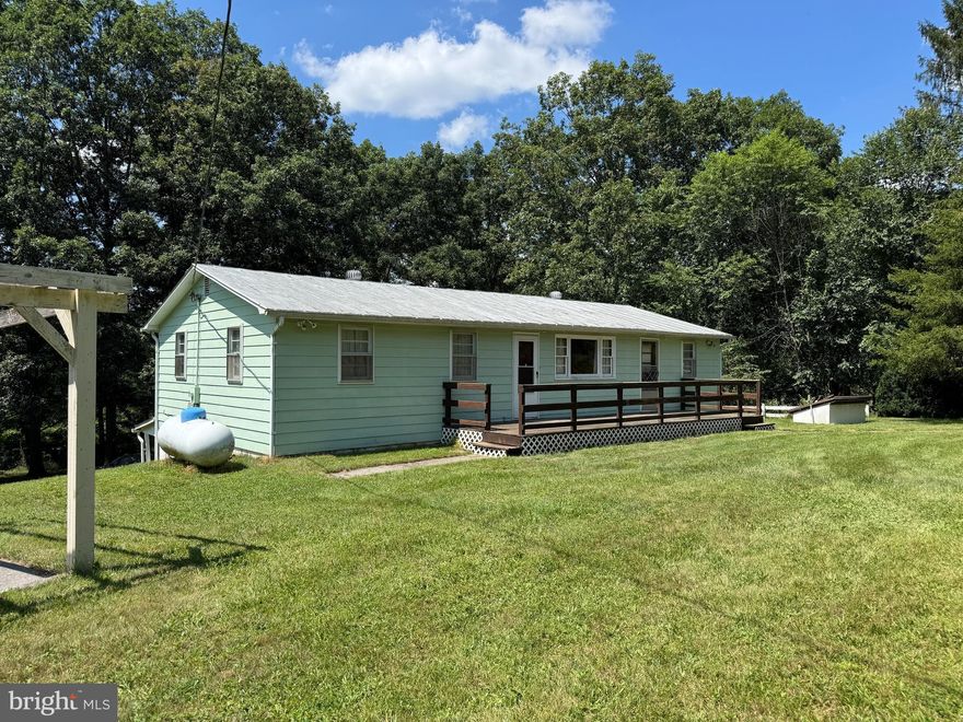 REDUCED!  Home with aprox. 2  acres  conveniently located along St. Rt 259, just minutes to VA line and easy drive to corridor H and to I-81.  Aprox. 45 minutes to Harrisonburg, VA.   Explore the nearby Lost River State Park or venture to tourist hot spots like Bryce Resort, Black Water Falls Smoke Hole Caverns & George Washington National Forest.  Home Features 3 Bedroom 1 Bath rancher,  full unfinished basement separate dining area and family room.