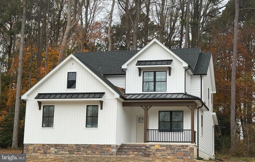 Start the New Year off in your new HOME! This is one of three BEAUTIFUL homes to be built on this picturesque location. Nestled just outside of town and within walking distance to the popular Milton Theatre or local fishing pier, this new construction can be yours! This home is well appointed with many already upgraded exterior and interior features. There are plenty of windows to view the beautiful back drop of trees.  First floor layout is as follows. A powder room,  den/office space, oversized laundry room with access to the two car garage,  a butlers pantry, a walk-in pantry closet,  spacious kitchen, great room opens to a good size eat in kitchen.  Upper level of the home you will find 4 spacious bedrooms and 2 baths. Interior luxury features are as follows. Vinyl waterproof flooring throughout, stained solid wood staircase, kitchen cabinets with soft close feature, hard surface countertop in kitchen and butler pantry, stainless steel kitchen appliances, electric fireplace, custom tiled owners shower and an indoor fire sprinkler system. Outside spaces are a covered front porch and rear screened in porch to enjoy the outdoors bug free.  Home is being constructed by Elite Homes LLC a Veteran owned company who has been building custom homes in Delaware for 24 years. Estimated time of completion for this home is December. The other two homes to be built here will have basements.