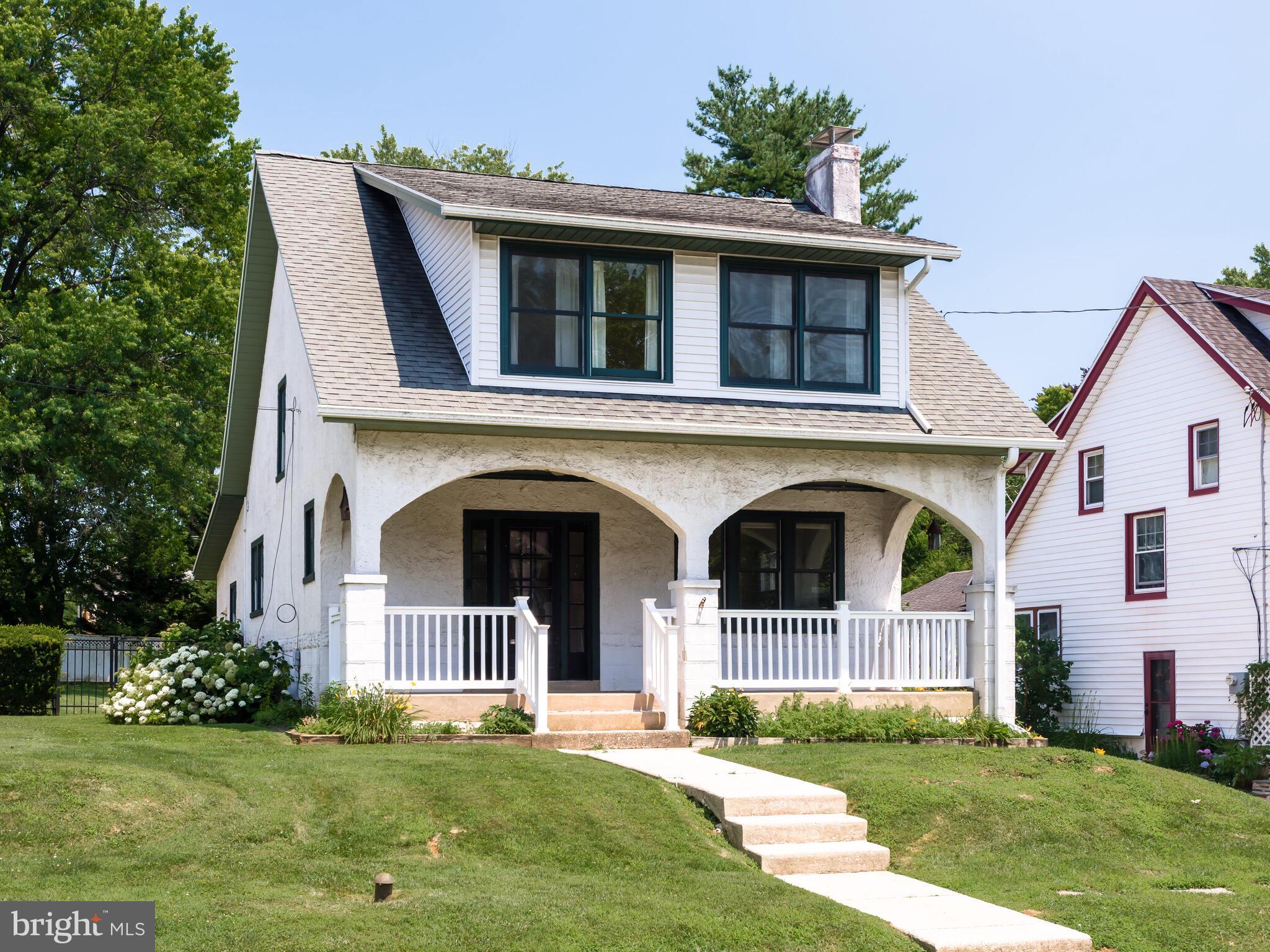 Step into this beautifully preserved single-family home, located on one of the most desirable and serene streets in Paoli. Built in 1924 and full of historic charm, this 3-bedroom, 2-bathroom home offers nearly 2,000 square feet of warm and inviting living space, set on a generous 8,000-square-foot lot. From the moment you arrive, you’re greeted by classic curb appeal, featuring a welcoming front porch perfect for enjoying quiet mornings or evening relaxation. Inside, original hardwood floors run beautifully throughout. The living room is cozy and full of character, anchored by a decorative wood-burning fireplace and bathed in natural light from large windows. The adjoining and generous dining room offers the perfect setting for both casual family meals and formal entertaining. In the kitchen you’ll find sleek countertops, ample cabinet storage, all necessary appliances including a dishwasher, microwave, and refrigerator, and space to create meals with ease. Just off the kitchen, the room opens up into a large family room complete with high ceilings and sliding glass doors that lead to the backyard. A full bath completes the first level. Upstairs, the home features three generously sized bedrooms, each with ample closet space and natural light completed with another full bath. The fully fenced-in backyard is a private oasis. Whether you’re grilling on the patio, gardening in the sun, or letting kids or pets play freely, this outdoor space offers something for everyone. Situated in the award-winning Great Valley School District, and within walking distance to local parks, shops, and Paoli Septa and Amtrak train station, 25 Manor Road offers the rare combination of suburban charm with exceptional commuter convenience. You'll enjoy easy access to Route 30, 202, and major thoroughfares, while still being tucked away on a peaceful, tree-lined street. This is a truly move-in-ready home with endless character and comfort — ideal for families, professionals, or anyone seeking a lifestyle upgrade in one of Chester County’s most vibrant communities. Two-year lease minimum. Landlord pays water and sewer. Tenants pays gas, electric and lawncare.