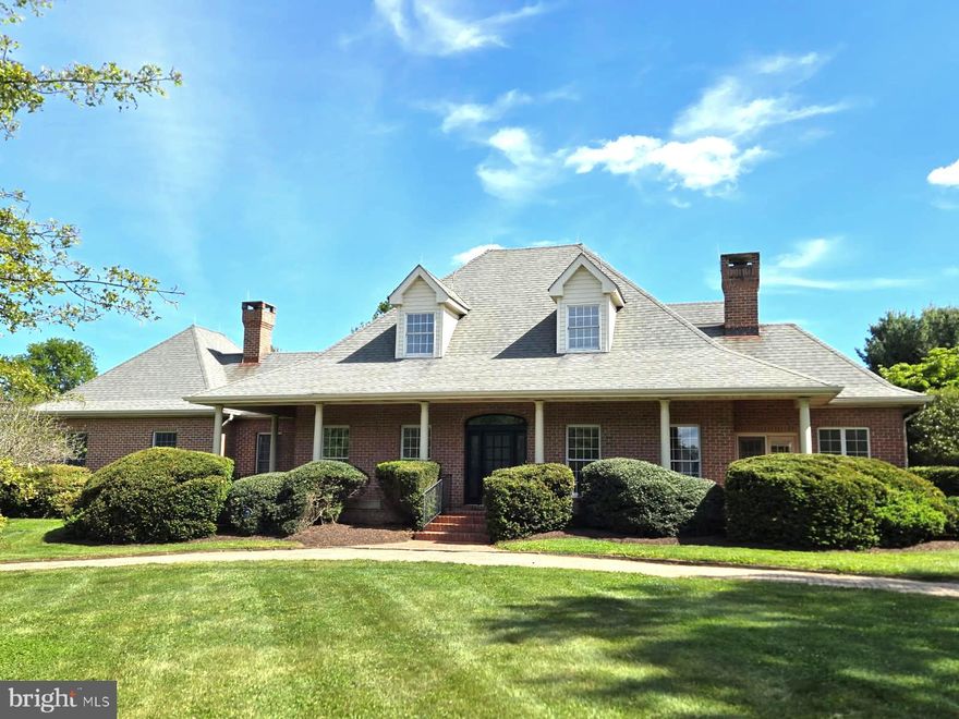 Nestled within the serene enclave of UVILLA ESTATES, this custom built Cape Cod inspired residence offers a harmonious blend of luxury and comfort, set on a sprawling 2.11-acre lot. The property, built in 1988, showcases timeless brick construction and an inviting traditional floor plan that effortlessly accommodates both relaxation and entertaining. The wrap-around front porch with finely detailed columns and railing add to the charm of this home. Step inside to discover a warm and welcoming interior featuring rich hardwood floors throughout. The heart of the home features a family room that flows seamlessly into the updated kitchen, complete with quartz countertops and stainless steel appliances, including a built-in microwave, range, and dishwasher. The pantry provides ample storage for culinary essentials. A charming breakfast area invites casual dining, while the formal dining room sets the stage for more sophisticated gatherings. The main floor laundry adds to the home's practicality, ensuring that daily tasks are a breeze. The home boasts a thoughtfully designed layout with a main level primary bedroom suite and an oversized bathroom featuring both a stall shower and a large soaking tub, perfect for unwinding after a long day. The two walk-in closets offer generous storage, in addition there is a private covered porch off the main bedroom, that is perfect for relaxing and enjoying the outdoors. The home features a fireplace in the living room with a gas insert with remote. There is also a wood stove in the family room that creates a warm ambiance, making it an ideal retreat during cooler months. The finished portion of the basement provides endless possibilities for customization, whether you envision a home gym, media room, or additional storage. It also features a wet/dry bar with small refrigerator and sink. Outside, the property is beautifully landscaped, featuring a lovely yard with mature trees, offering both privacy and a picturesque setting. There is a beautiful large deck that is great for entertaining that overlooks the backyard which is partially enclosed with a maintenance free powder coated aluminum fence. The oversized two car garage has enough space for a workshop. Enjoy the tranquility of a no-thru street, perfect for leisurely strolls or bike rides. This residence is not just a home; it's a lifestyle. Additional amenities include a security system for peace of mind and a water treatment system for enhanced living quality. Experience the perfect blend of luxury and comfort in this remarkable property, where every corner invites you to create lasting memories.