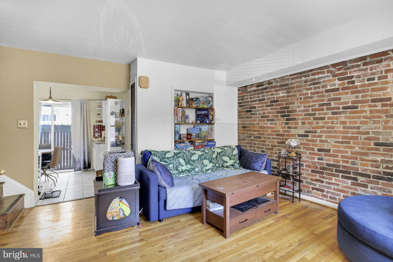 Welcome to 1905 Rodman St! This fantastic 2 bedroom / 1 bathroom single family home is located in the desirable Rittenhouse Square neighborhood. Featuring hardwood floors, exposed brick walls, in-unit laundry, and a private deck, this spacious home is sure to impress! You enter into the living room with exposed brick walls and a working wood-burning fireplace at its centerpiece. There's a large window at the front and built-in shelving for added convenience. Head back to the dining area and then to the kitchen at the back, complete with granite countertops, red tile backsplash, and ample storage space. Continue on the 2nd Floor to view a hall closet and your full bathroom with a lighted vanity and a lovely tiled bathtub / shower combo. The 1st bedroom offers Southern exposure for abundant sunlight. There's a wonderful wooden deck off the hallway - perfect for entertaining in the warmer months! Upstairs on the 3rd Floor is your primary suite boasting a full wall of built-in closets. A Juliet balcony overlooks the deck below. There is a full-sized washer & dryer in the basement, plus a utility sink and storage space for added convenience. Central air ensures comfort all year long - call today! About The Neighborhood: Nestled in Rittenhouse, this is an ideal Center City location walking distance to anything you would need! Close to some of the city's best restaurants, cafes, shopping, grocery and entertainment options. Just a few blocks from Rittenhouse Square, South Street, and the Marian Anderson Recreation Center. Accessible to public transportation SEPTA bus routes for an easy commute throughout the city. Check out neighborhood favorites like Southgate, Barclay Prime, Monk's Cafe, Parc, Founding Father's, Tio Flores, and tons more!