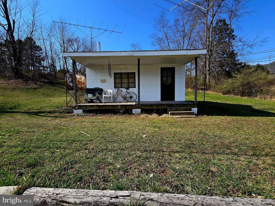 Residential or Commercial use available for this property. Never been on the market and was the Original Post Office to Brandywine. Own a piece of history in Pendleton County. Sitting on just under an acre, you can use this space for storage, an office or build a home on top of the hill. Public water is available for hook-up.
Don't miss out on this opportunity. Call today to schedule a showing before it's GONE!