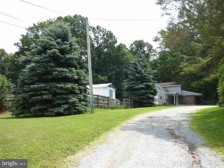 The property is a short sale, approved listing price in Dec. Being sold in "AS-IS" condition and require CASH or CONVENTIONAL financing (higher down payment) ONLY. Property is in need of work. 1/2 acre lot with trees, cleared area, and views. Barn with electric and fenced pasture area. Unique house layout, patio, covered patio. Appliances and woodstove convey with sale. Most of driveway belongs to this property, but neighbor has rights to use.