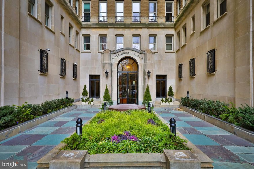 Perched on a high floor in the Rittenhouse Plaza, this corner one bedroom plus den, two bath residence offers exceptional light, space, and views in one of Philadelphia’s most sought-after locations on Rittenhouse Square. With three beautiful exposures, the home is filled with natural light throughout the day. The west-facing den enjoys lovely sunset views and features custom built-ins, creating an ideal office or sitting room. The expansive living and dining areas face north and east, capturing open skyline views and soft morning light. Original floors with mahogany inlay run throughout the home, adding timeless character and warmth. The generously sized kitchen offers gas cooking, side by side laundry, and ample workspace.    The spacious primary bedroom is both quiet and inviting, featuring built-in bookshelves and an en-suite bath with a window for natural light and ventilation. Storage is a standout feature of this home. A separate hallway offers four large closets and houses the second full bathroom, providing exceptional functionality. This residence presents a wonderful opportunity to customize a truly special home in one of Philadelphia’s rare New York-style prewar Co-ops. The Plaza is known for its classic architecture, private courtyard garden, attentive service, and unparalleled location. This pet-friendly building offers a 24 hour concierge and unmatched access to the best of Center City. The monthly co-op fee includes real estate taxes, Fios cable and internet, heat, water, sewer, and building maintenance. A one-time transfer fee equal to 2% of the purchase price is payable at closing. Nearby parking options are available for rent within one block.