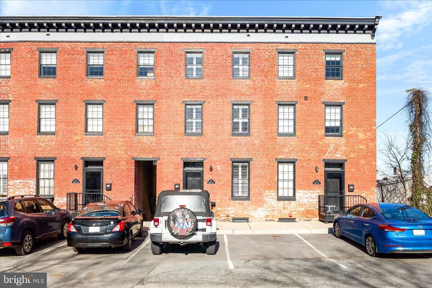 Welcome to this truly unique, one-of-a-kind renovation project in Downtown Frederick! These beautiful 4Br/3Ba units, are the perfect blend of modern living and historic charm. Located steps from Carroll Creek, this rowhome is perfectly situated for walkability and proximity to all amenities. From the moment you enter, the renovation of this historic property shines with modern kitchen with island, exposed brick, newer appliances and *new* refrigerator, custom iron stair cases with 10' ceilings, plenty of daylight, and easy living. On the second level, you will find two well sized bedrooms, laundry, a shared bath with dual vanities, tile shower, and plenty of space for livability. On the completely private upper level, a loft styled area with full bath, storage, and adequate space could be used as a private bedroom or home office. The lower level is completed with a walkout basement to the patio, a full bath, tons of storage, and space for additional bedroom or entertainment area. This is a well renovated project in Downtown that is very unique for the area. Proximity to MARC train, breweries, shops, dining and local commuter routes is unmatched!