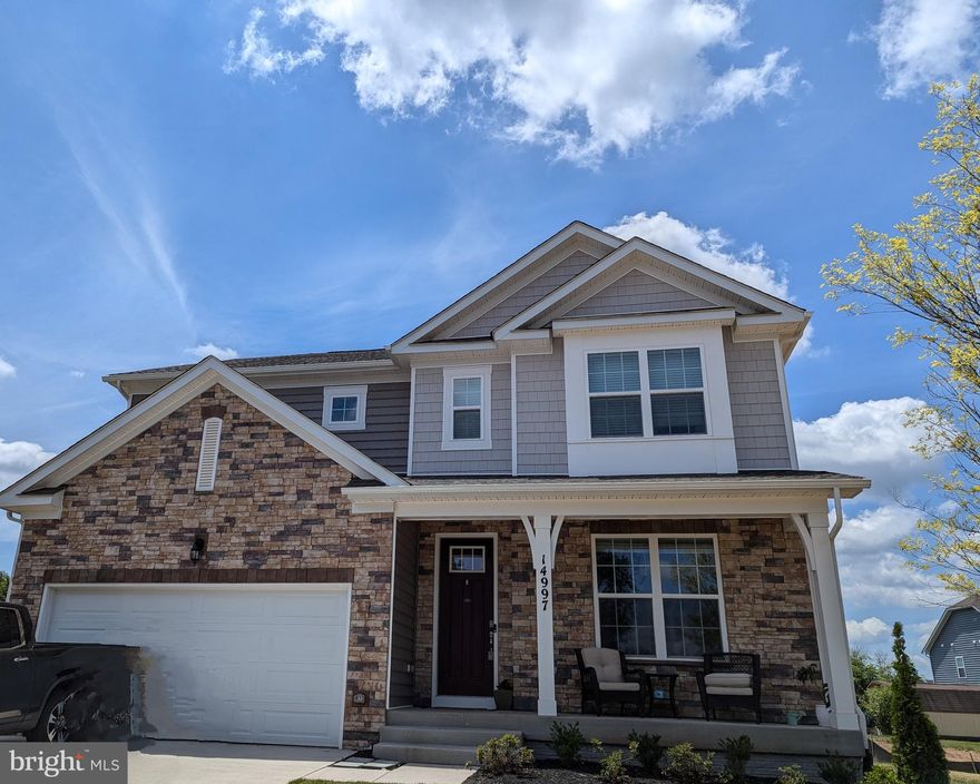 Here it is- Ready for move in. Who is looking for new address in Haymarket? Come look at this almost New Construction- Welcome. This Hampshire model is on a spacious .25-acre homesite, complete with a walkout basement. Three finished levels. A great front porch adorned with stacked stone on a private cul-de-sac road. The modern floor plan with a main level bedroom and full bath are amazing. complete with an expansive signature kitchen adorned with quartz countertops, an enormous, large island and stainless new appliances and oversized pantry!  Bragging here a total of 5 bedrooms, 4 bathrooms, and a 2-car front load garage, this home is the epitome of perfection. The finished basement features a large recreation room, large bedroom, and full bathroom, which opens up a myriad of possibilities for your lifestyle. Located just minutes to old town Haymarket and to 66, 15, and 29. Call today to make this your address!