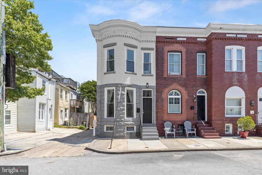 Welcome to this two bedroom, two and a half bathroom end-unit rowhome in the Federal Hill Historic District, complete with a rear parking pad. Completely updated throughout, the home boasts a neutral color theme, abundant natural light, tall ceilings, and rich engineered hardwood floors throughout the main level. The inviting front living room features elegant crown molding that continues into the separate dining room. The spacious kitchen is equipped with stainless steel appliances, quartz countertops, a stylish tile backsplash, 42-inch soft-close shaker cabinets and a center island. Completing the main level is a half bathroom with a laundry closet and access outside to the rear. Upstairs, the primary bedroom is a true retreat, with a walk-in closet and a luxurious bathroom that features a dual-sink vanity and walk-in shower with a frameless glass door. Down the hall are the second bedroom and second full bathroom. The lower level offers ample storage space and the potential to finish and expand the living space. Located in one of Baltimore’s most sought-after neighborhoods, this home is close to all that Federal Hill, Riverside and Locust Point have to offer with top-rated restaurants, lively bars, boutique shops, entertainment, and everyday essentials just around the corner. Quick access to downtown, the Inner Harbor, major highways, and public transit ensures effortless commuting.