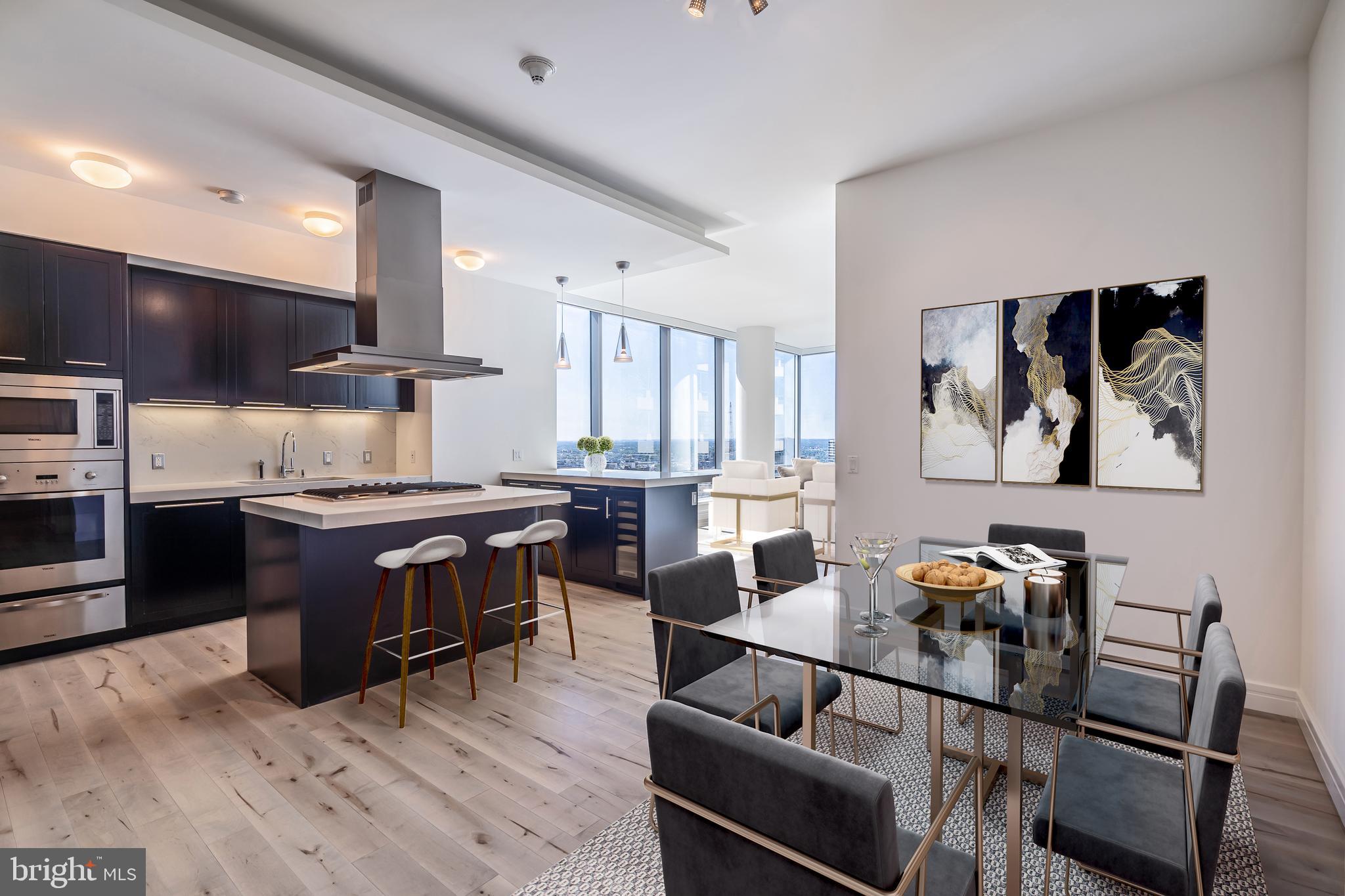 NEWLY RENOVATED WITH PARKING INCLUDED! Residence 36GH is a 2,356 square foot 3 bedroom, 3.5 bath corner home which offers some of the most incredible sunset and city views you won't find anywhere else. It is the most premiere white-glove full-service building Philadelphia has to offer in Center City living. Live in one of the world's most iconic brands, world-class staff, and white-glove services all in a superior location where you can get out of the city in minutes. From this exceptional home, you will have an unobstructed sunset view and the evolving Philadelphia skyline. Among the many world-class amenities, there are two chauffeured-resident house cars, a Mercedes S 560 and a Cadillac Escalade. The state of the art fitness facility overlooks City Hall and Dilworth Park, indoor pool, locker rooms, private Yoga room, hot tub, a brand new Resident Lounge with outdoor area and unbelievable Theater Room. The best in Location, luxury brand, amenities, white-glove services, iconic unobstructed views, high-end designer finishes and a lifestyle second to none! Floor to ceiling operable windows in every room (a unique feature in Center City), soaring ceilings, gorgeous hardwood floors. The gourmet designer kitchen which offers island seating and is open to both the living and dining areas features Sefina cabinetry, Viking built-in gas cooking and microwave, Sub-Zero refrigerator, Miele dishwasher, Uline wine cooler, Dornbracht fixtures, Pietra Bedonia countertops, Franke stainless steel under-mount sink, glass tile backsplash. The luxurious master bath features Calacatta marble floors, and countertops, double vessel sinks, Bain ultra-soaking tub, Duravit commodes, separate stall shower with frameless glass enclosure. Powder room with Calacatta marble floors, pedestal sink, and Duravit commode. Bosch washer and dryer. The Ritz is a pet-friendly building with an on-site dog run. Parking available in the on-site, underground garage. In addition to private services and amenities only available to residents, you may also enjoy in-residence dining from the adjacent Ritz-Carlton Hotel, restaurant, spa services and more!