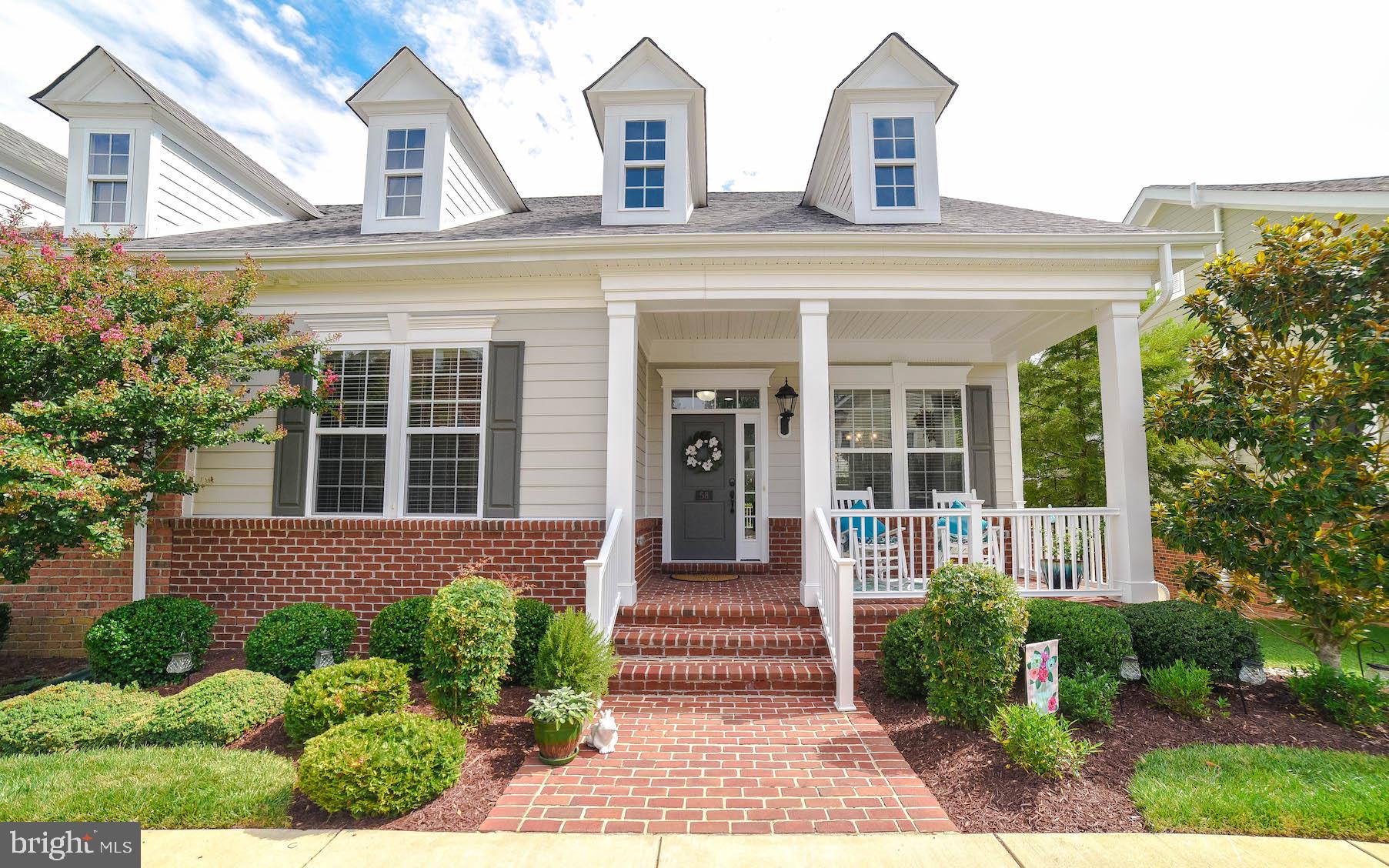 Welcome home to this low maintenance, meticulously maintained end-unit in the sought-after Villages of Steeplechase community!!! No need to worry about yard work, landscaping, or snow removal... all taken care of for you! This community truly sells itself also offering a pool, fitness center, playground, bikes & walking trails!!! Make your way from the charming front porch and enter the front door to an open floor plan with gleaming hardwood floors, wide crown molding, custom white Bali Blinds, and tons of natural lighting flooding in throughout entire main level. The main level of this home features foyer, washer & dryer, gourmet kitchen with breakfast bar, great room, master suite with attached full bath, and spare bedroom with attached full bath. Stroll past the foyer into the stunning kitchen… Kitchen showcases wide 42" cabinets, stainless steel appliances, gas stove, side by side fridge, built in microwave, granite counters, AND panty. Kitchen overlooks bright and airy great room with built-in bookshelf and gas fireplace! Perfect for cozy winter evenings. Sliding glass door off great room brings you to patio backing to woods… where any nature lover can enjoy watching the hummingbirds and hearing the birds sing!! Master suite on main level has huge walk-in closet, ceiling fan, and attached master bathroom with oversized shower and double sinks! Second bedroom on main level is equipped with wiring for ceiling fan and has attached full bathroom. Make your way to the lower level to find Rec Room with ceiling fan & recessed lighting, full bathroom, bedroom #3, and bedroom #4 (bedroom #4 has large closet but no egress window). But wait... there's more! This home also includes oversized driveway, 2-car garage, and wired with Security System. This incredible location makes your commute easier to Andrews AFB, DC, NOVA, Pax, Indian Head & Dahlgren. Run don't walk... this home won't last long!!!!