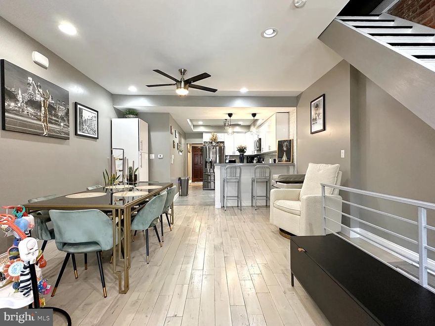 LOCATION, LOCATION, LOCATION! Welcome to this fully custom 2 bed 2 bath situated on a wide street with EASY parking in South Philadelphia. Excellent transportation access; close to major arteries like Broad Street, Oregon Ave, I-76, I-95 and walking distance to the Philadelphia Sports Complex! Minutes from Passyunk Avenue and just a short drive to shopping centers and big-box retail. Upon entering you'll love the open floor plan with handsome exposed brick, Alaskan white oak hardwood flooring and a custom eat-in kitchen with HEATED tile flooring. Just beyond the kitchen is a full custom bathroom which includes a freestanding soaking tub (perfect for your little ones) and Carrara marble tile floors. Beyond the first floor bathroom, you'll find a nice, private back yard space ideal for entertaining in the warmer months. Upstairs you'll find two exceptionally large bedrooms with expresso walnut hardwood floors and a luxurious full bathroom boasting heated tile floors with a HUGE two person shower and seating bench.  The main bedroom is large enough for a king size bed and features a full walk in closet with tons of storage space. The second bedroom offers flexibility as a nursery, home office, gym, library, creative studio or even another walk in closet for someone with a hefty wardrobe. The basement is fully finished and features epoxy floors, closet space, washer/dryer with ample storage. Beyond the pocket doors, you have a mechanical room which houses a high efficiency tankless water heater and air conditioning unit. And finally, a BIG value add here is that the 1st floor has been fully soundproofed allowing a huge quality of life improvement. Whether you're downsizing, buying your first home, starting a family, or teaming up with roommates, this home offers flexibility, comfort and room to grow. This is a great opportunity to put down roots and build equity while enjoying everything South Philly has to offer! Don't miss this opportunity to win BIG.