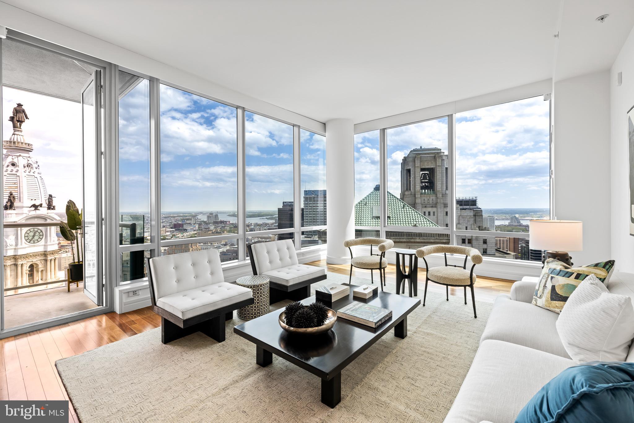 The super rare BC combo unit which floats near the top of The Ritz is an exceptionally designed residence boasting 3 bedrooms plus a Den, 4.5 bathrooms and is adorned with luxurious finishes throughout. Positioned on the 40th floor which delivers incredible William Penn Views north and jaw dropping Eastern views over the Ritz Carlton Hotel to the Delaware River. Each moment spent within this sanctuary unveils a captivating panorama, from radiant sunrises to enchanting Cityscape.
After being greeted by a gracious entry foyer with a powder room you’ll enter the grand corner living space flanked by floor to ceiling windows at every turn. A truly elegant living, dining, sitting and entertaining space. The kitchen which is the heart of this residence is replete with a slab quartz counter-top and back-splash, paneled Subzero refrigerator, Viking 5- burner gas cook top, built-in microwave, convection oven, warming drawer and Miele Dishwasher.
The magnificent master suite is one you’ll remember and features two separate bathrooms, two separate custom walk-in-closets, a sitting room and secondary entry / exit. Both master bathrooms are outfitted in white marble…. One features a soaking tub. This suite is positioned on the premier northern side of the tower delivering a completely unobstructed inspiring and a dramatic vantage.
The subsequent two bedrooms are located on the other side of the home in this thoughtfully designed layout and each have sumptuous en-suite marble bathrooms and special views of the River East.
Additional standout features include a terrace, a highly sought after intimate den or secondary family room off of the living space, a suburban size walk-in laundry room, roughly 10 foot ceilings and custom millwork.
A combination of square footage and jetliner views unattainable anywhere in the City at this price. Roughly 80 feet of City Hall Frontage.
This Sale DID NOT include a parking license