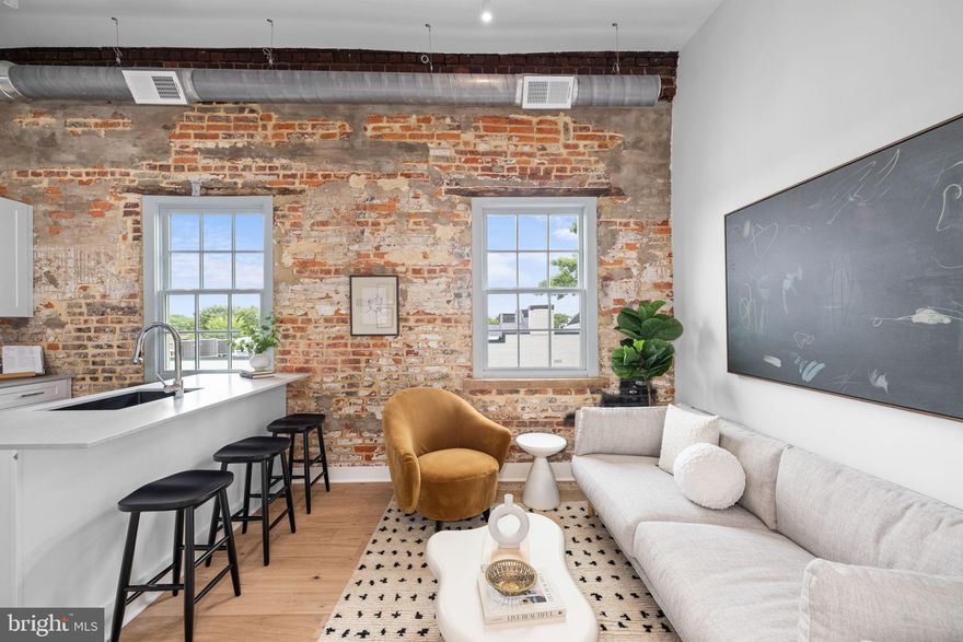 Nestled in the heart of Old Town Alexandria, this charming 1 bedroom, 1 bathroom apartment offers a perfect blend of historic charm and modern luxury. Featuring one junior bedroom and a well-appointed bathroom, the residence boasts exposed brick walls that add character and warmth to the space. The kitchen is a culinary dream with a spacious island and luxury finishes. Experience the rooftop deck with breathtaking views, providing an ideal space for unwinding or entertaining outdoors. The in-unit washer and dryer add convenience to your daily routine, and the building offers both elevator access and a modern community gym for your fitness needs. If you require additional room, paid storage solutions are available. Parking is conveniently located nearby for rent, ensuring easy access to your vehicle. This rental offers more than just a residence—it’s an elevated way of living. Immerse yourself in the historic charm and vibrant lifestyle of Old Town Alexandria, making this exquisite home your perfect urban retreat. Please note that the staged photos shown are of a similar unit and may not reflect the exact features or layout of the available unit.